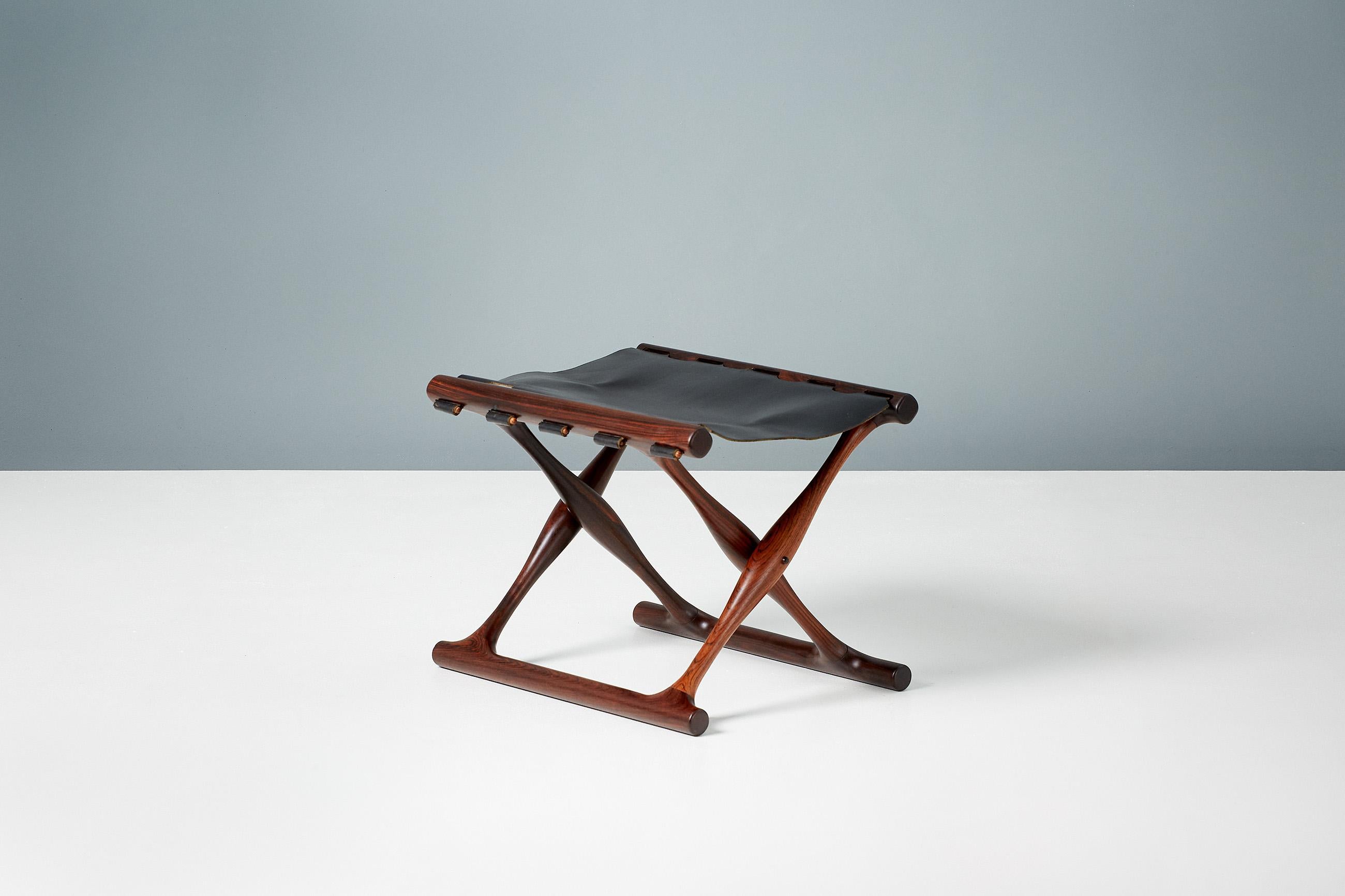 Poul Hundevad

Guldhoj folding stool, 1948

Rarely seen pair of Model 41 folding stools in Brazilian rosewood with black saddle leather seats. The Guldhoj stool was designed as a replica of a Bronze Age artefact found in Vamdrup, Denmark that
