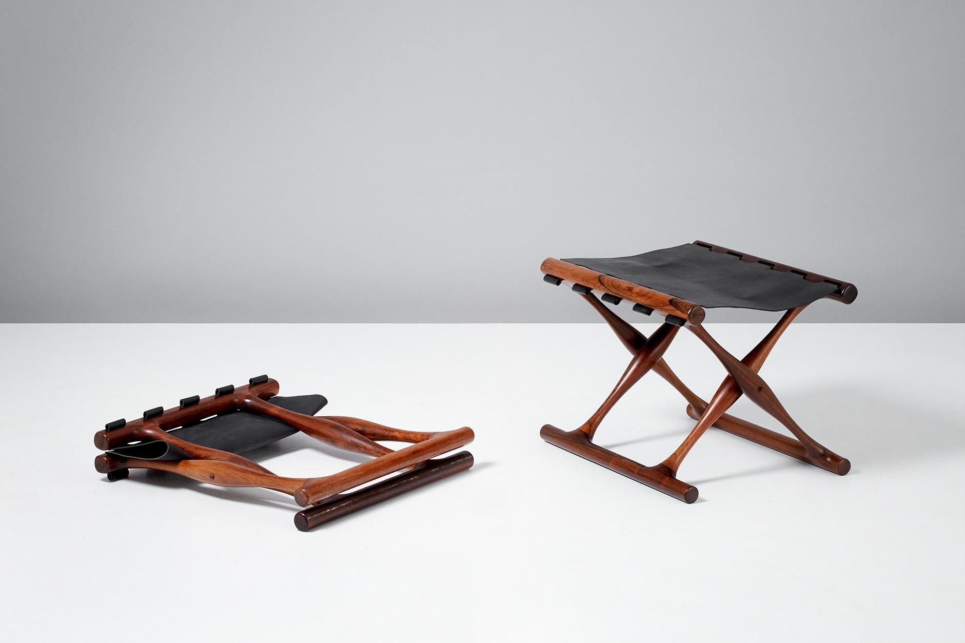 Poul Hundevad

Guldhoj Folding Stools, 1948

Rarely seen pair of Model 41 folding stools in Brazilian rosewood with black saddle leather seats. The Guldhoj stool was designed as a replica of a Bronze Age artefact found in Vamdrup, Denmark that