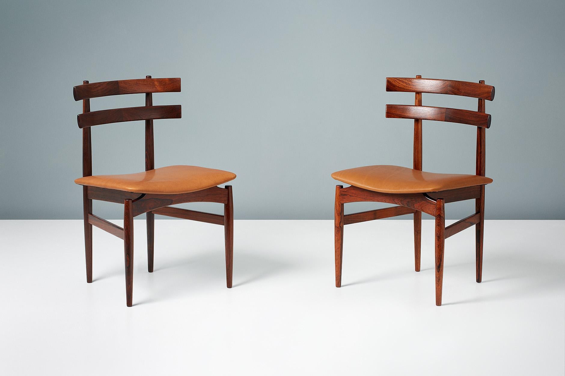 Rarely seen set of six sculptural Brazilian rosewood dining chairs by Poul Hundevad. The seats have been newly upholstered in aniline cognac brown leather. Manufactured by Poul Hundevad in Vamdrup, Denmark, circa 1958. 

 