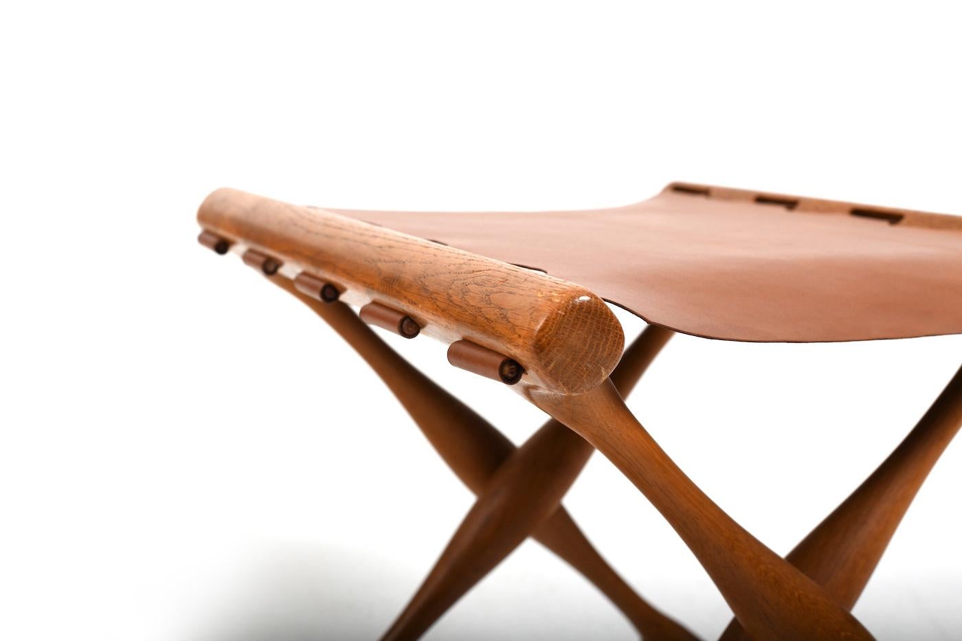 Guldhøj folding stool by Poul Hundevad. Model PH-41. Made in oak. Later new brown vintage leather cover. Produced by Poul Hundevad Vamdrup Denmark 1960s.