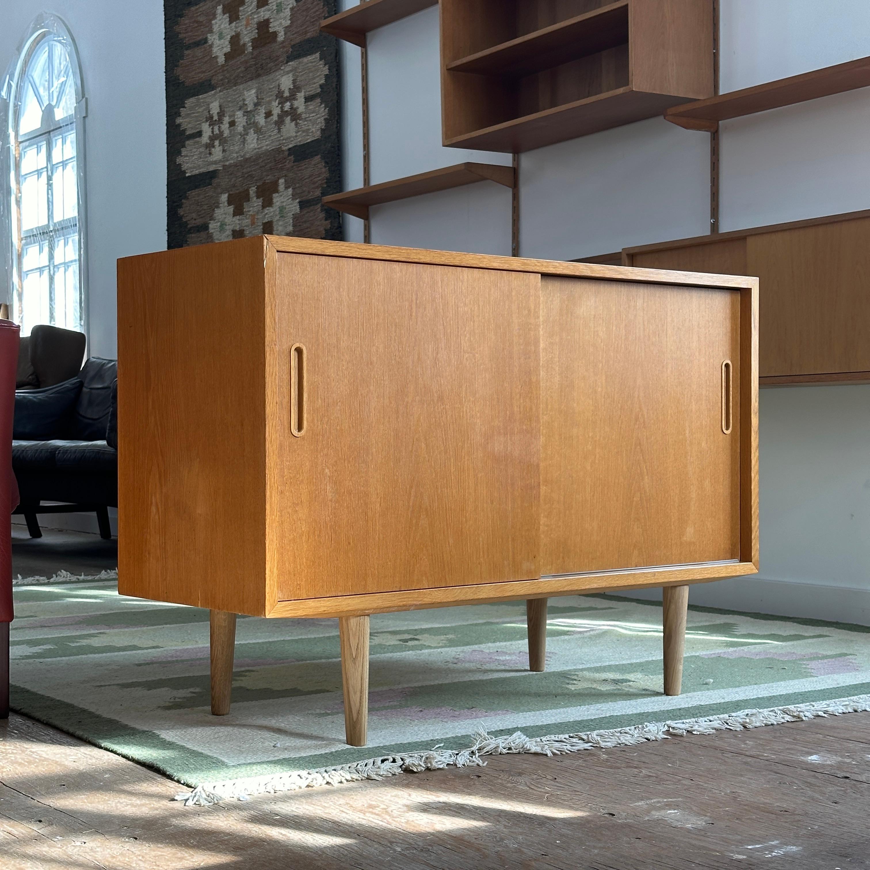 Condition: Unrestored

Dimensions: 42.5” L x 16.75” D x 29.5” H

Description: A vintage oak sideboard by Poul Hundevad. Freshly imported from Denmark.

Restoration is included in the price. Turn-around time 3-4 weeks. Can be available as is for a