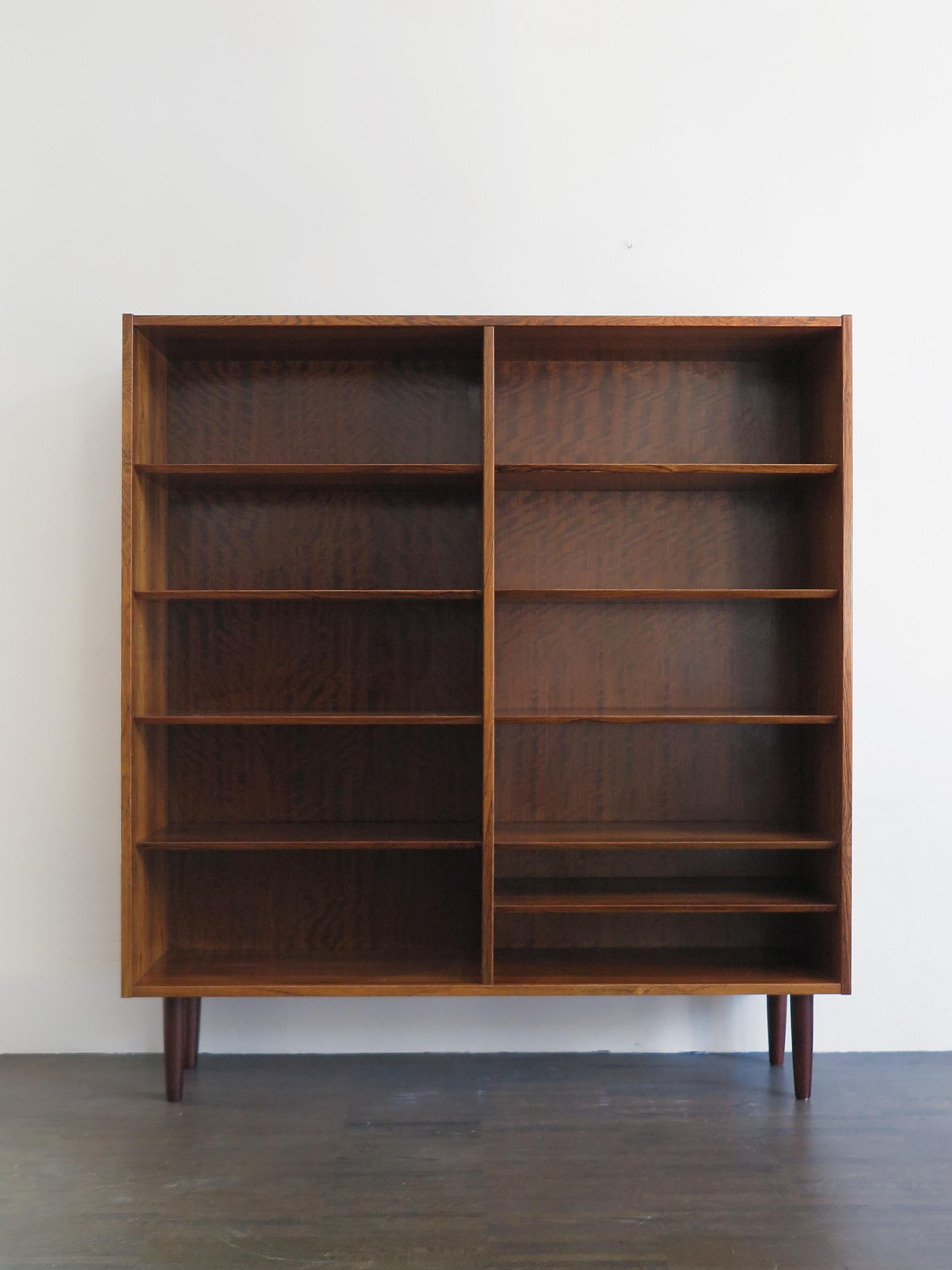 Scandinavian Mid-Century Modern design darkwood bookcase designed by Poul Hundevad and produced by Hundevad Møbelfabrik in the 1960s, variable height position of shelves, Denmark 1960s

Please note that the item is original of the period and this