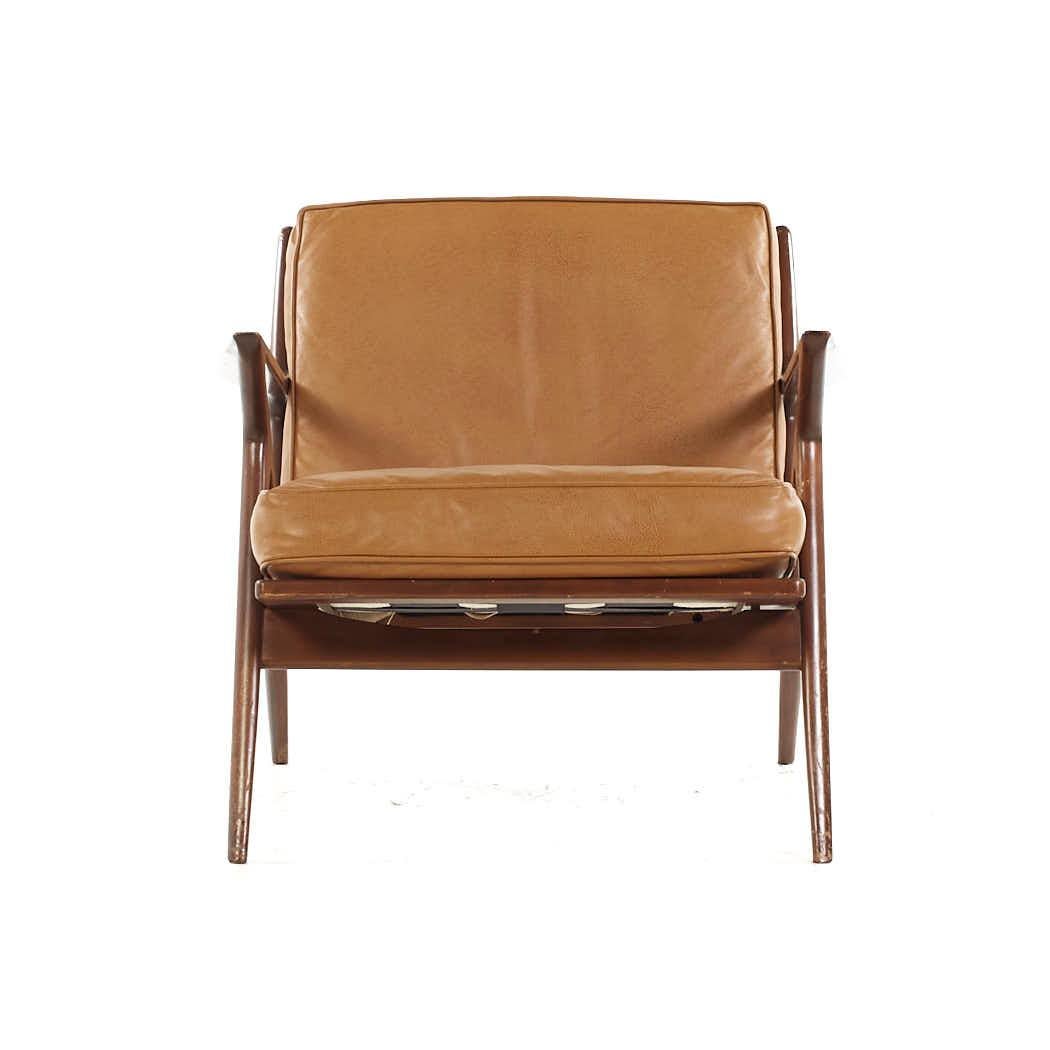 Poul Jensen for Selig Mid Century Danish Walnut Z Lounge Chair

This chair measures: 29.75 wide x 33 deep x 27 high, with a seat height of 17 and arm height/chair clearance 22.5 inches

All pieces of furniture can be had in what we call restored