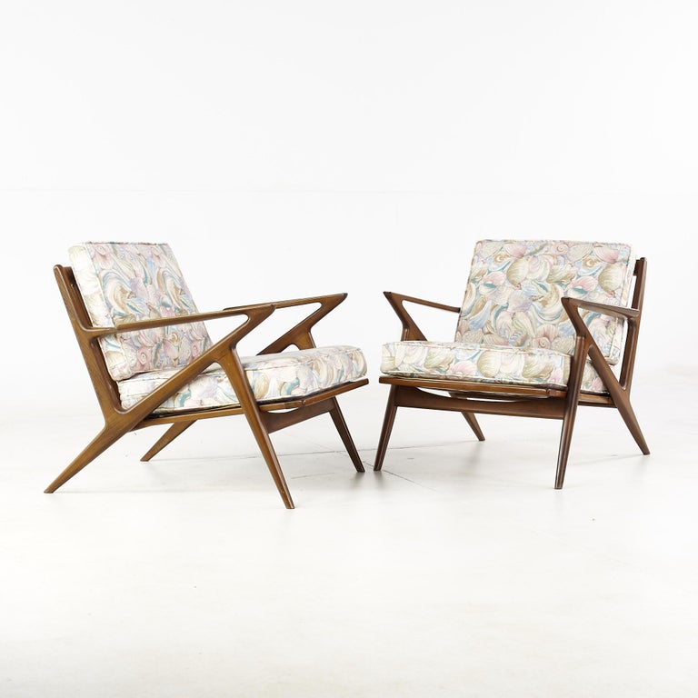 Poul Jensen for Selig mid-century walnut z lounge chairs - pair.

Each chair measures: 29.5 wide x 32 deep x 26.5 inches high, with a seat height of 16 and arm height of 21 inches.

All pieces of furniture can be had in what we call restored
