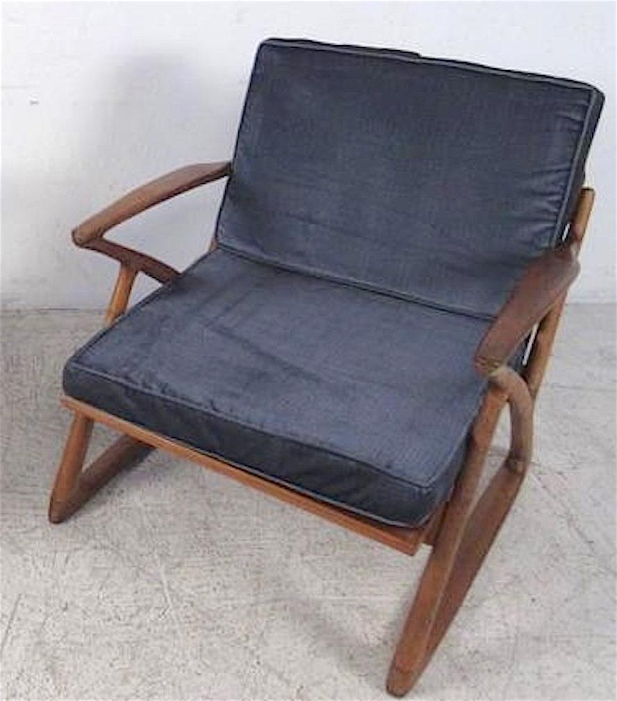 Sculpted frame mid-century modern arm chair with two removable cushions. Great shape with sled leg base and 