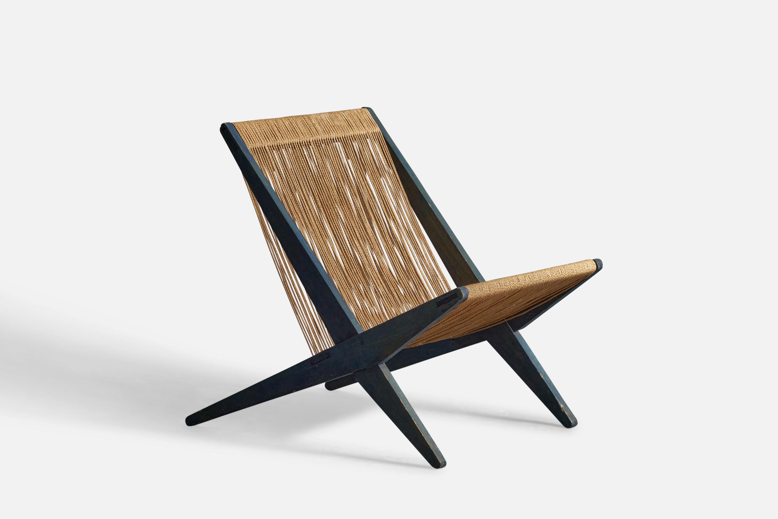 A blue-painted pine and papercord lounge chair or slipper chair, design attributed to Poul Kjærholm, Denmark, 1960s.
