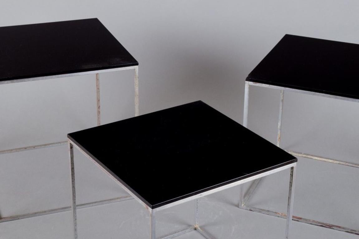 Poul Kjærholm, Danish furniture designer. A set of nesting tables PK 71.
Brushed steel frame, black acrylic tops.
Produced for Kold Christensen.
From the 1960s.
In excellent condition with minor signs of use.
Largest table: H 28.0 cm x 28.0 cm.

