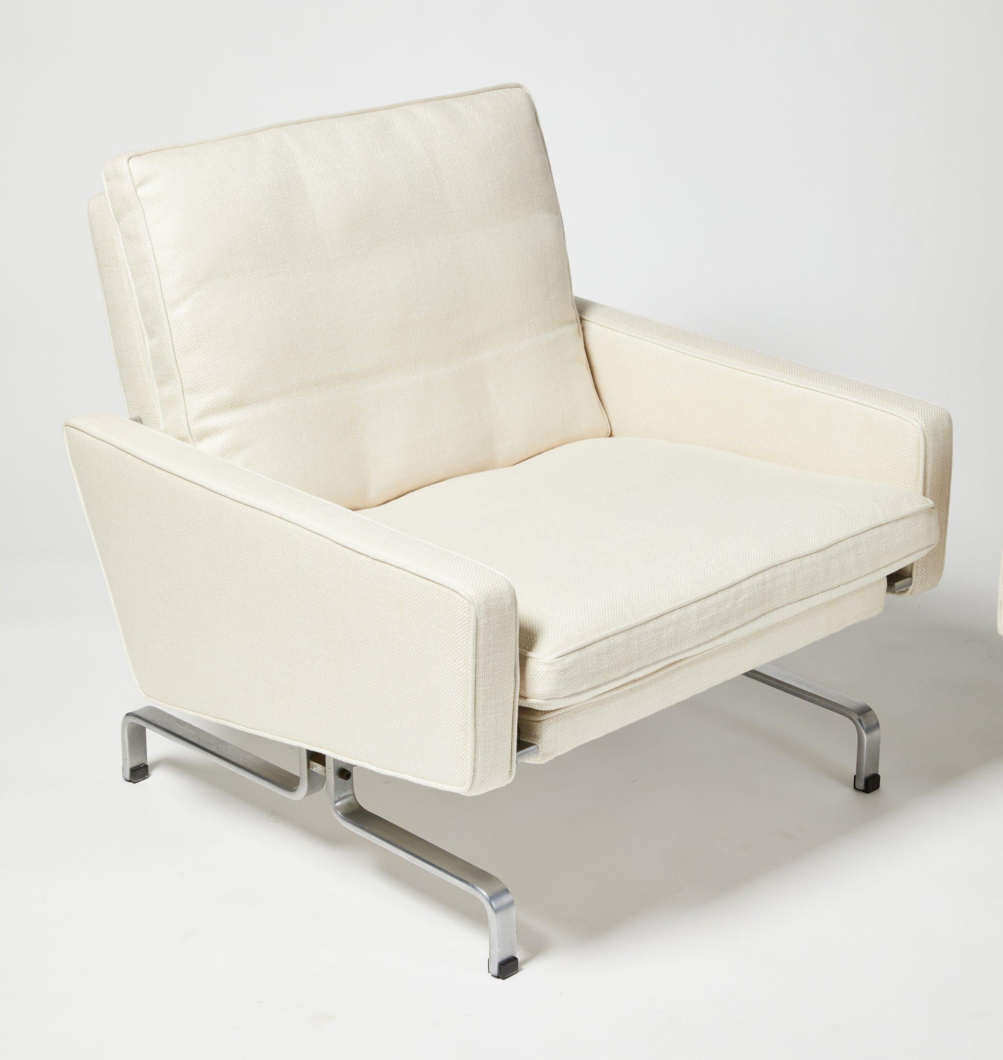 Pair of ?PK-31 ?by Poul Kjaerholm for E. Kold Christensen. Brushed steel and new linen fabric upholstery.