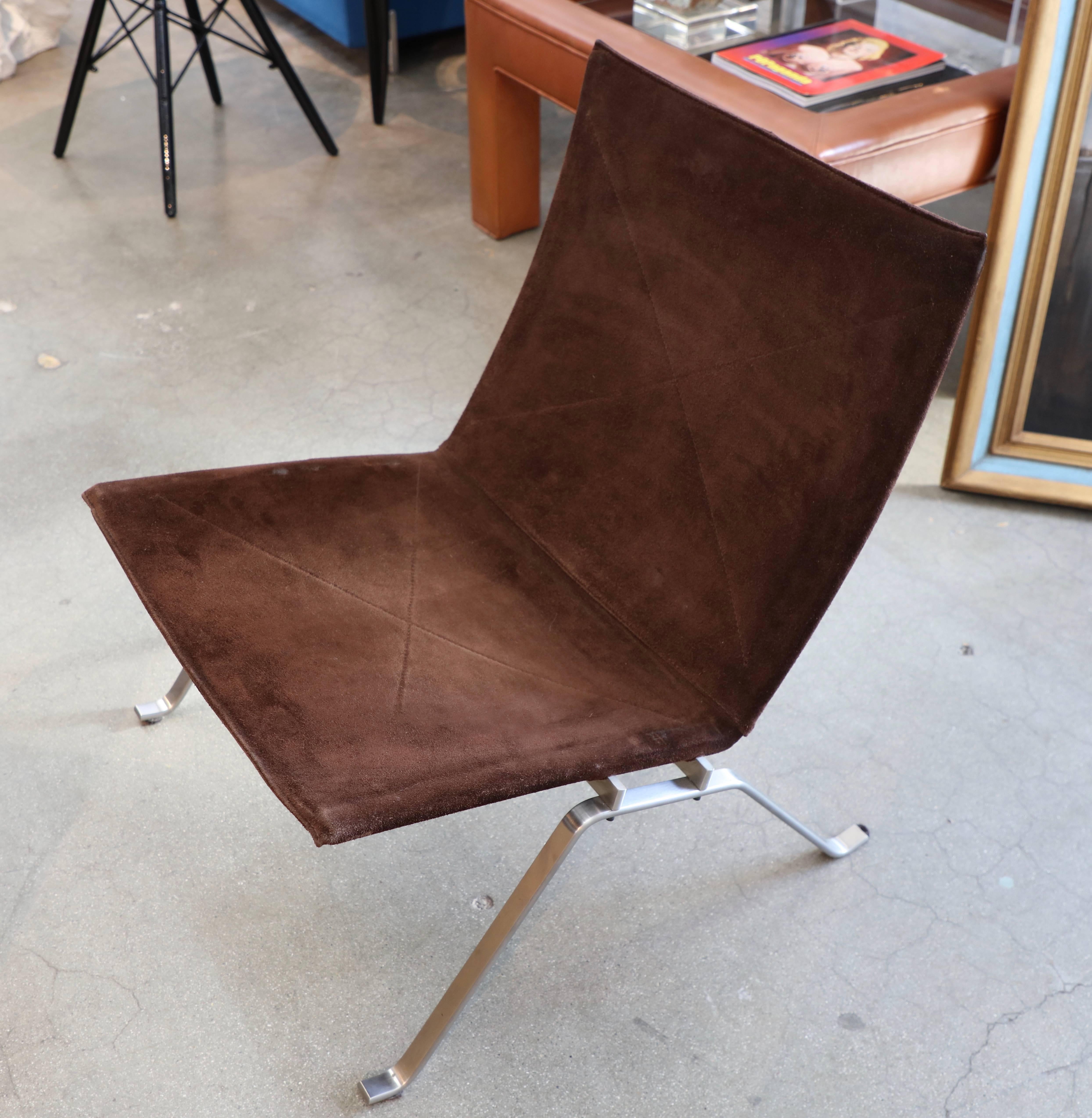 A nice older Fritz Hansen PK-22 chair originally deigned by Poul Kjaerholm in brown suede. A nice classic design It is marked n the base and fabric. Please note there are worn spots to the suede, which are pictured. An iconic design.