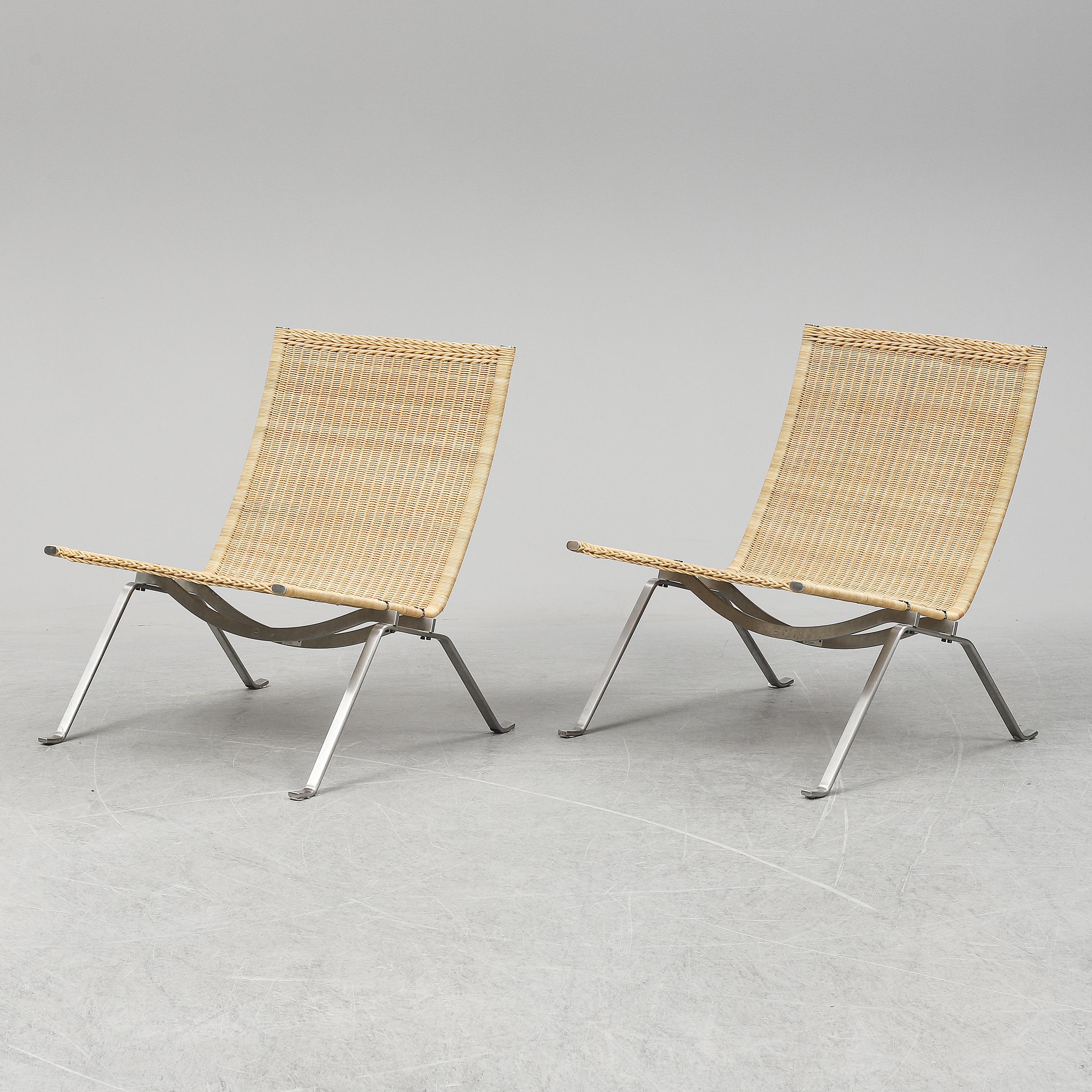 Pair of cane easy chairs model PK-22 designed by Poul Kjaerholm for E. Kold Christensen and produced by Fritz Hansen in Denmark.