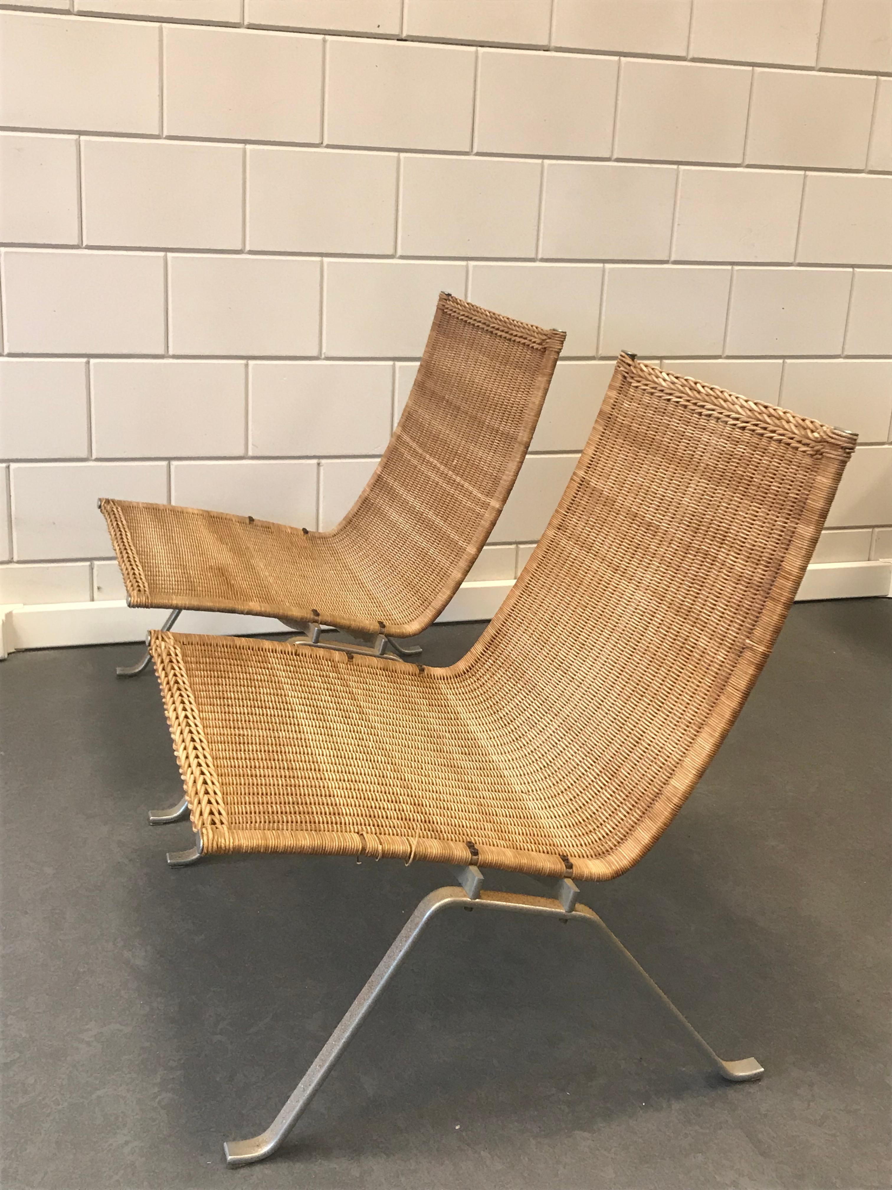 A pair of classic Kajerholm design easy chairs for sale.Brushed steel frame with wicker seating.
Designed in the 1950-ies for Kold Christensen.
The cane is nicely patinated over time and the chrome has oxidation.I can always sent extra photos on