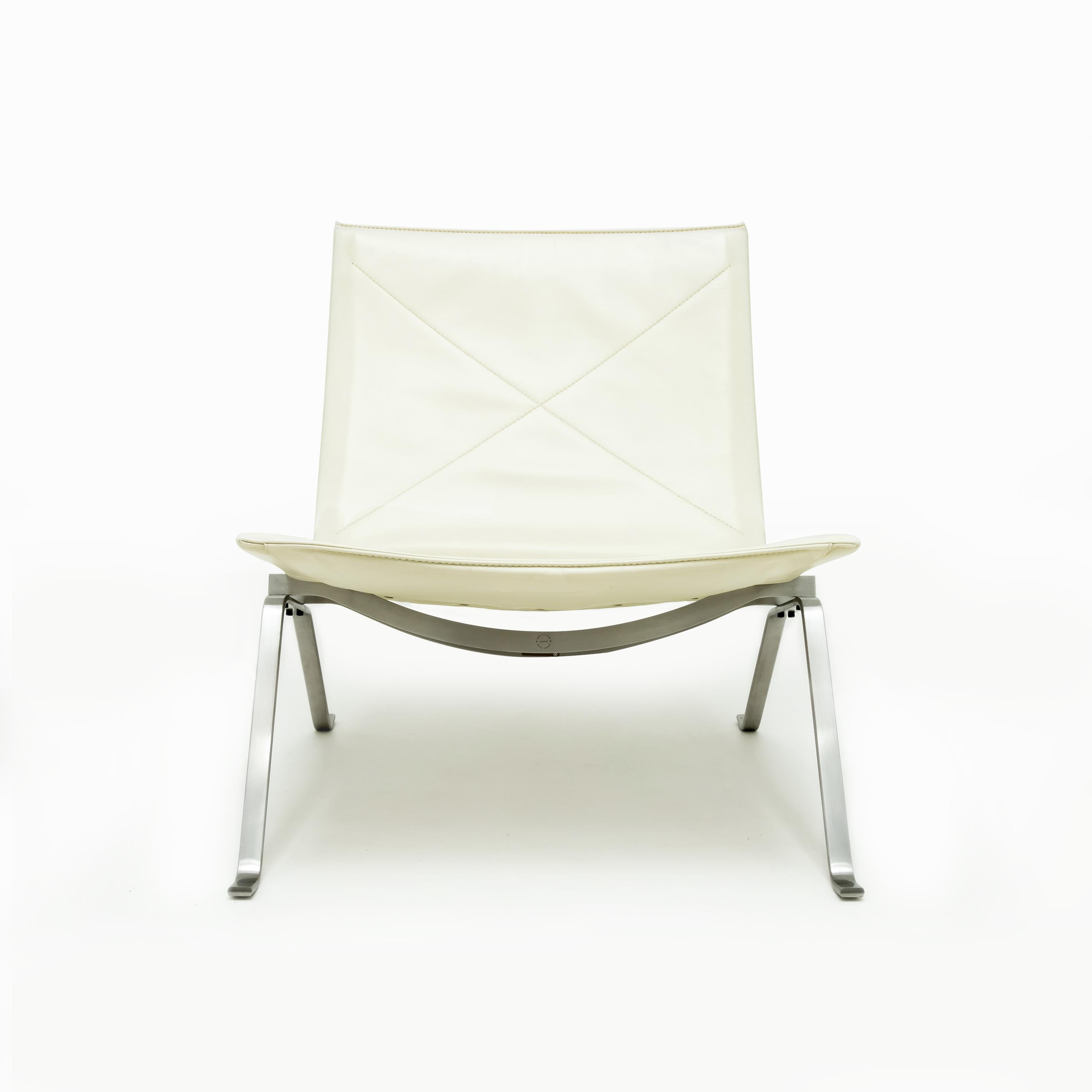 A Poul Kjaerholm PK22 Lounge chair in polished, brushed steel and cream leather for Fritz Hansen. There are two virtually identical chairs available. The price shown is per chair.

Originally designed in 1956 the PK22 stands out as one of