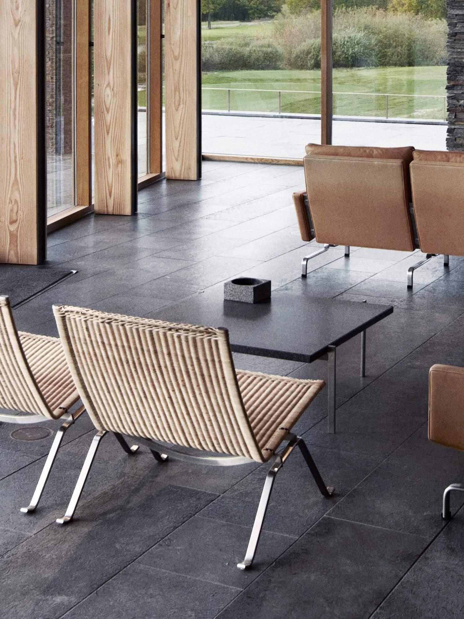 The Poul Kjaerholm PK22 Lounge Chair in Wicker by Fritz Hansen is an iconic design masterpiece crafted from the highest quality natural materials. It features a steel-welded frame, woven wicker seating and back to suit any room. Experience luxury