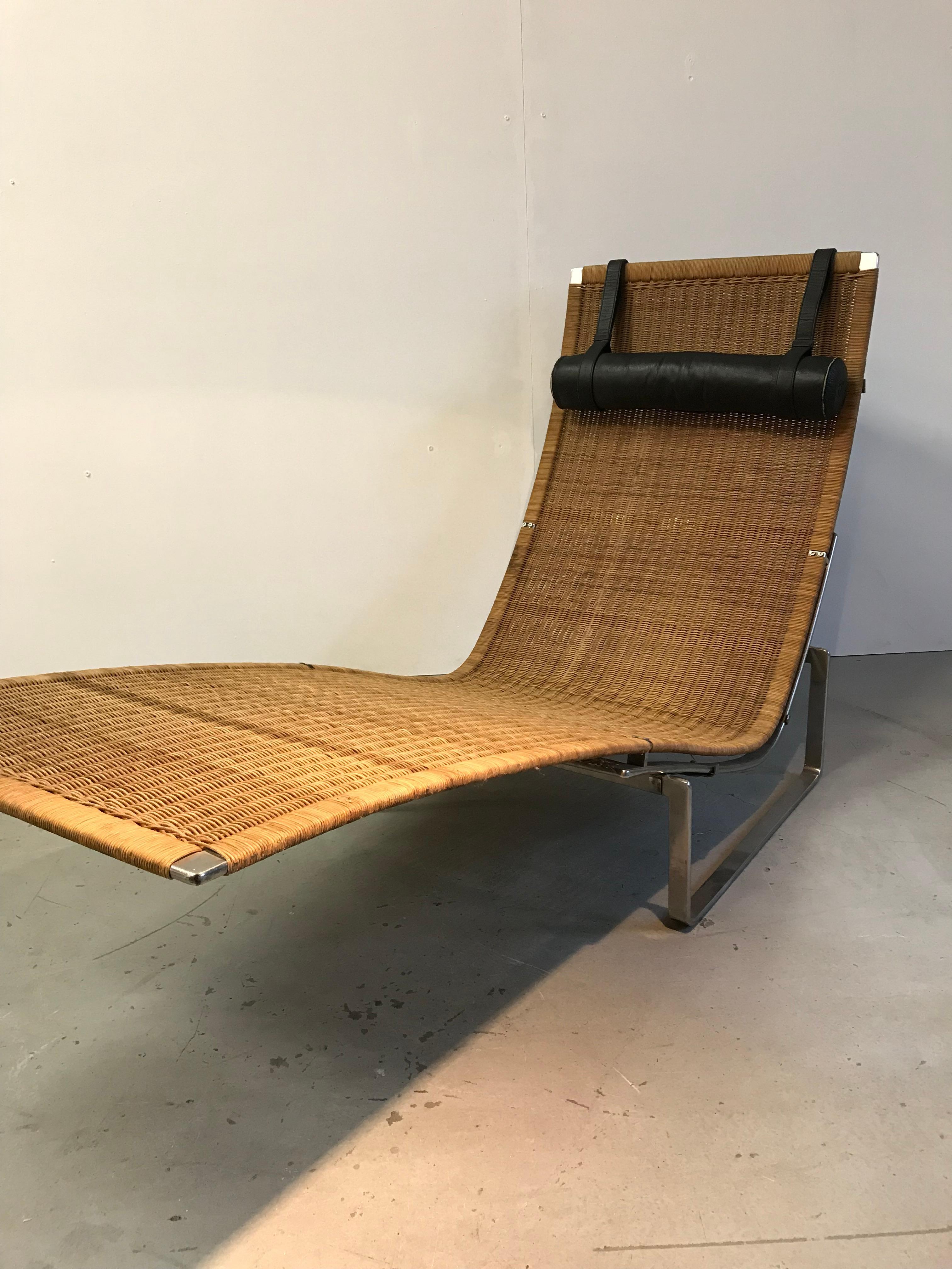 Poul Kjaerholm PK24 Kold Christensen from the 1970s.
Black leather cushion with nice patinated wicker.
Good vintage condition.
 