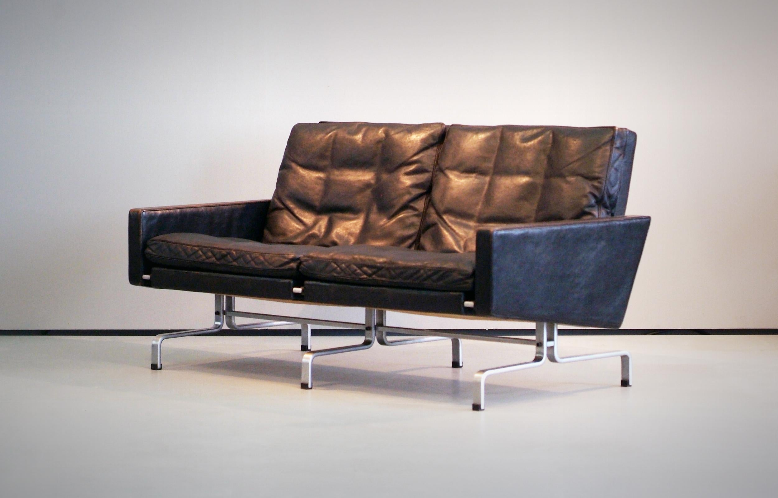 Poul Kjaerholm PK31/2 Sofa with black leather and (matte) chromed steel. Produced by E. Kold Christensen - Early Version. Marked with EKC Imprint. Wonderful all original condition - very small 
craquelé areas (in the upper leather layer) on the