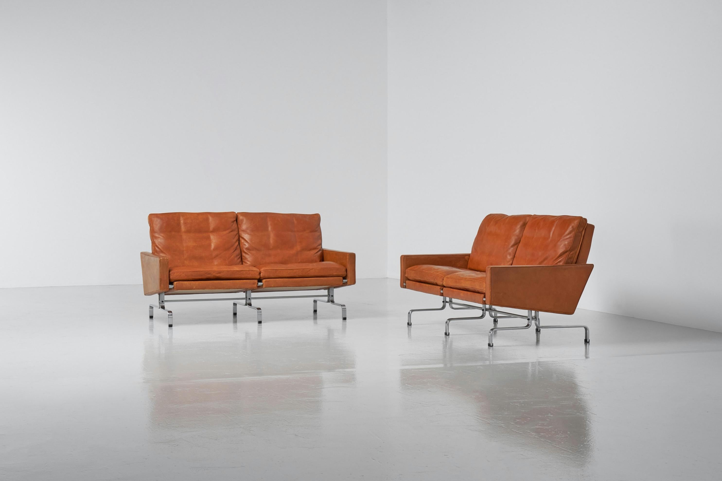 Amazing matching pair of sofas designed by Poul Kjaerholm and manufactured by Ejvind Kold Christensen, Denmark 1957. The PK 31 was both a lounge chair and a modular seating element that could be joined in groups to create a variable length. Two