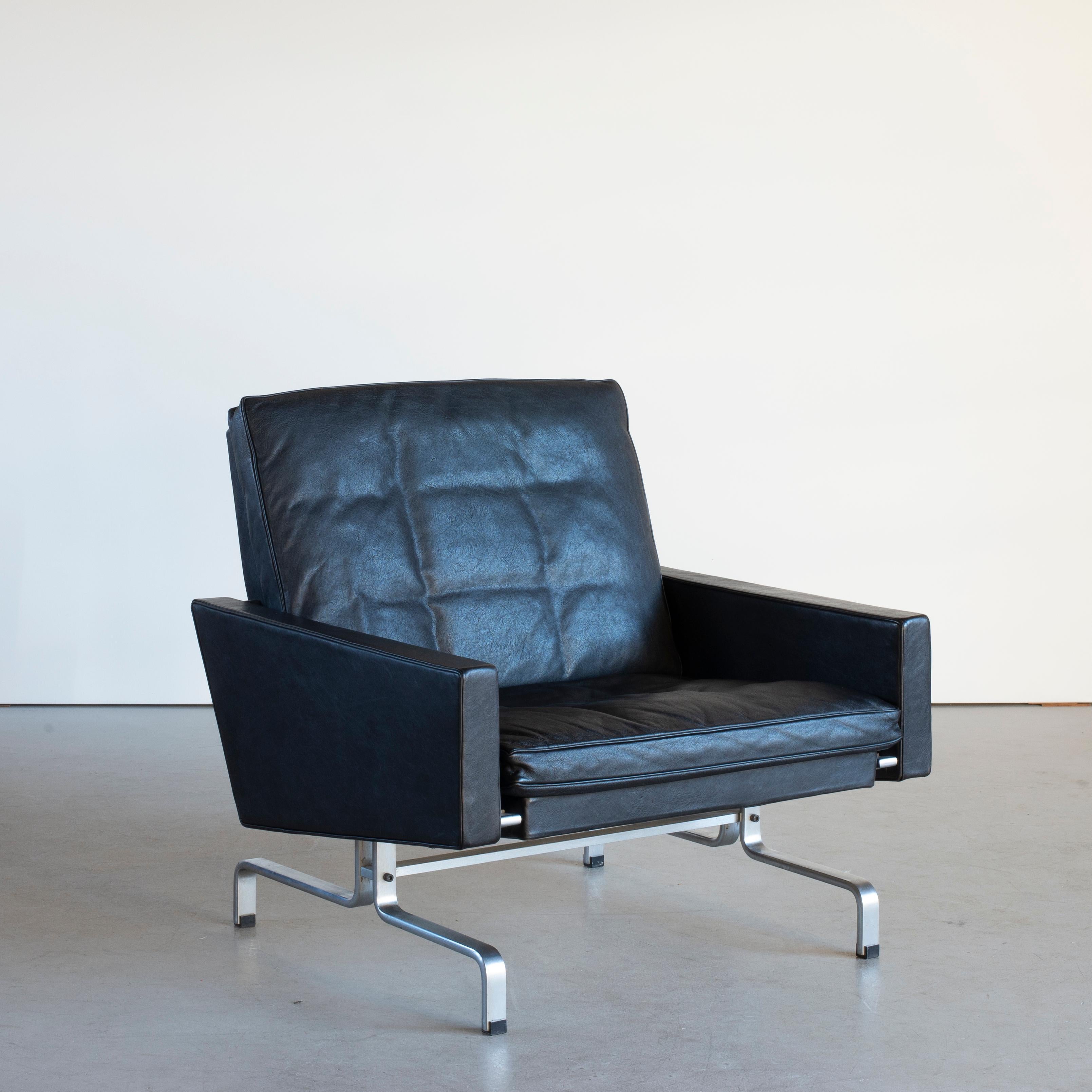 Poul Kjaerholm PK31 easy chair. Dull chromium-plated steel, black colored oxhide, loose down cushions. Executed by E. Kold Christensen, Denmark.