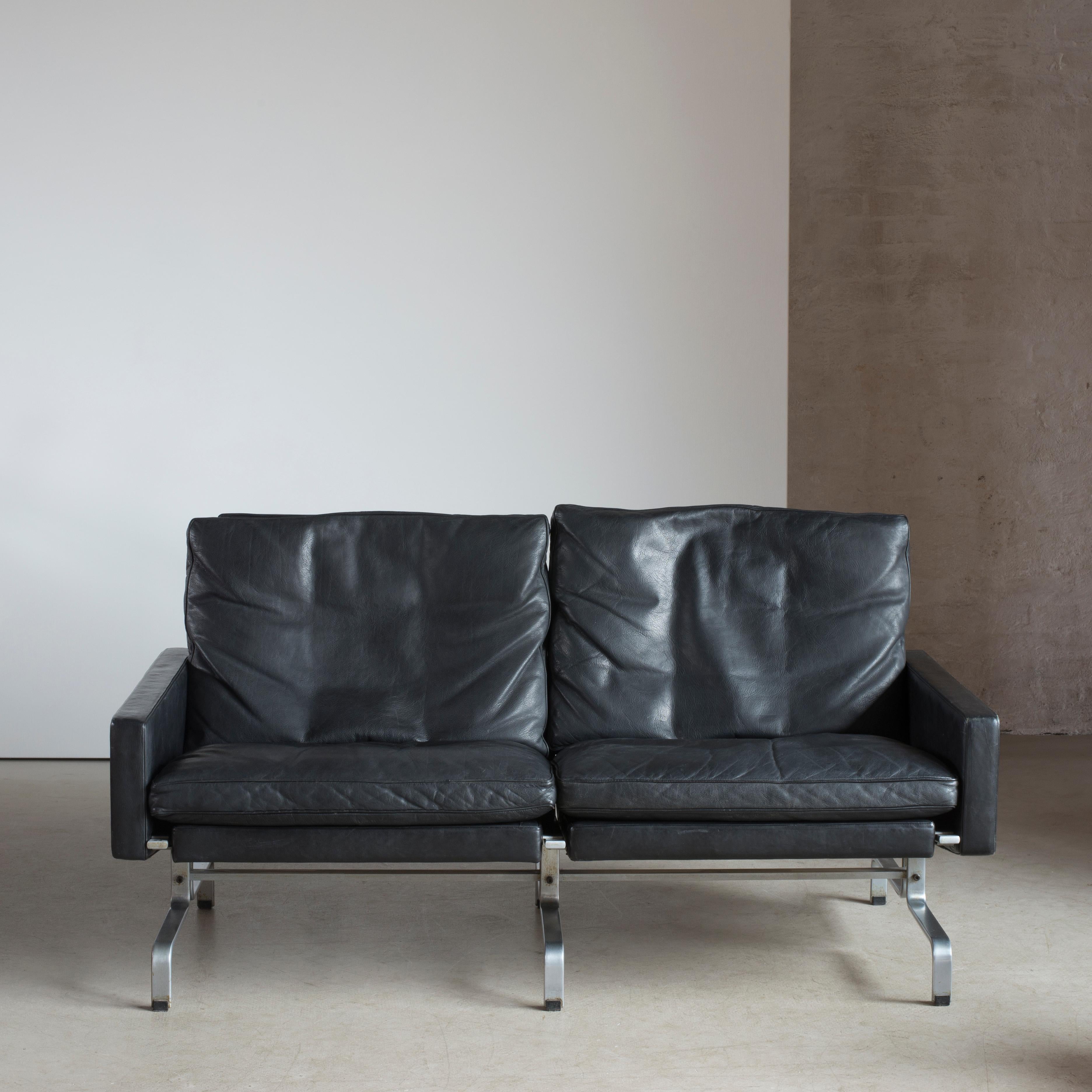 Poul Kjaerholm PK31 sofa. Dull chromium-plated steel, black colored oxhide, loose down cushions. Executed by E. Kold Christensen, Denmark.
