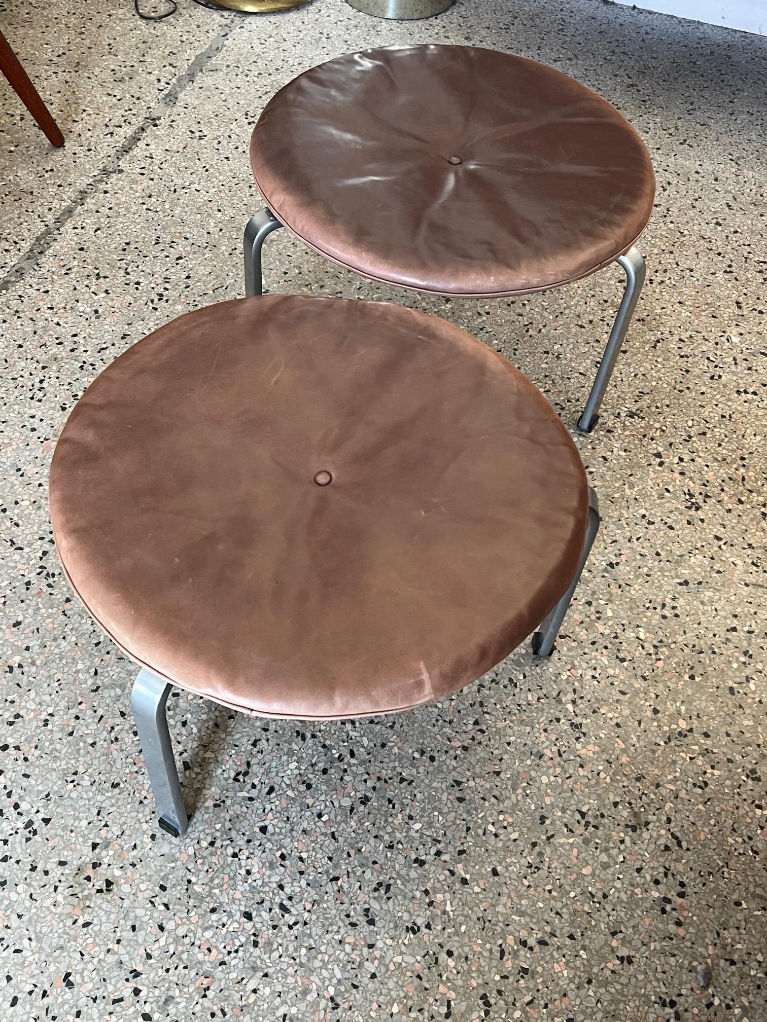 A pair of rare and early production PK33 stools. Designed by Poul Kjaerholm and executed by E.Kold Christiansen, Denmark, ca' late 1950's. Chrome plated steel with original intact, hard rubber gliders, horsehair upholstery and Sorensen leather with