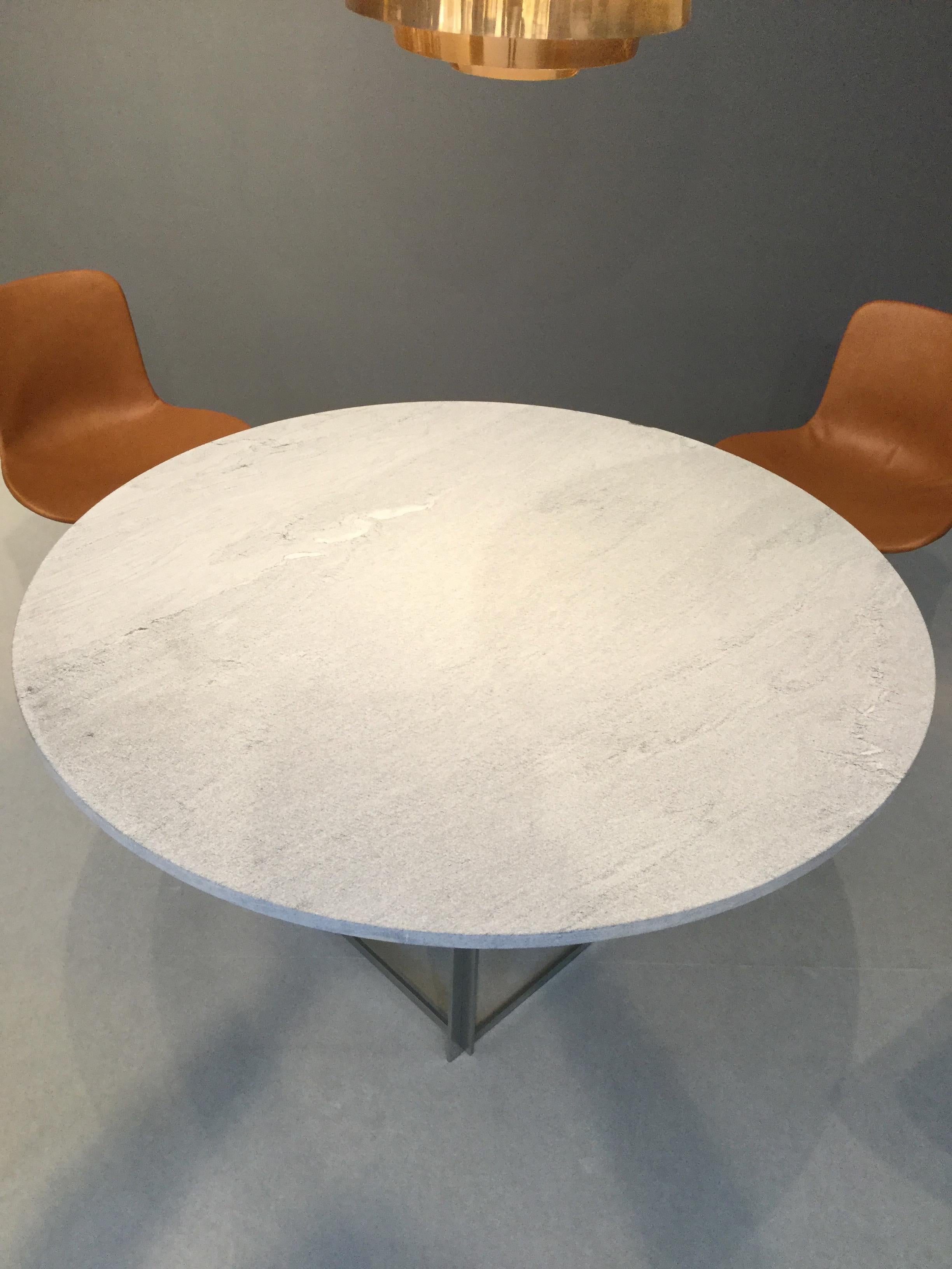 Poul Kjaerholm PK54 table (1963) and four (4) PK9 chairs (1963) executed by Ejvind Kold Christensen, circa mid-1960. Table top of flint-rolled Cipollini marble, chairs in cognac brown leather. All pieces are individually marked with EKC stamp. 
 