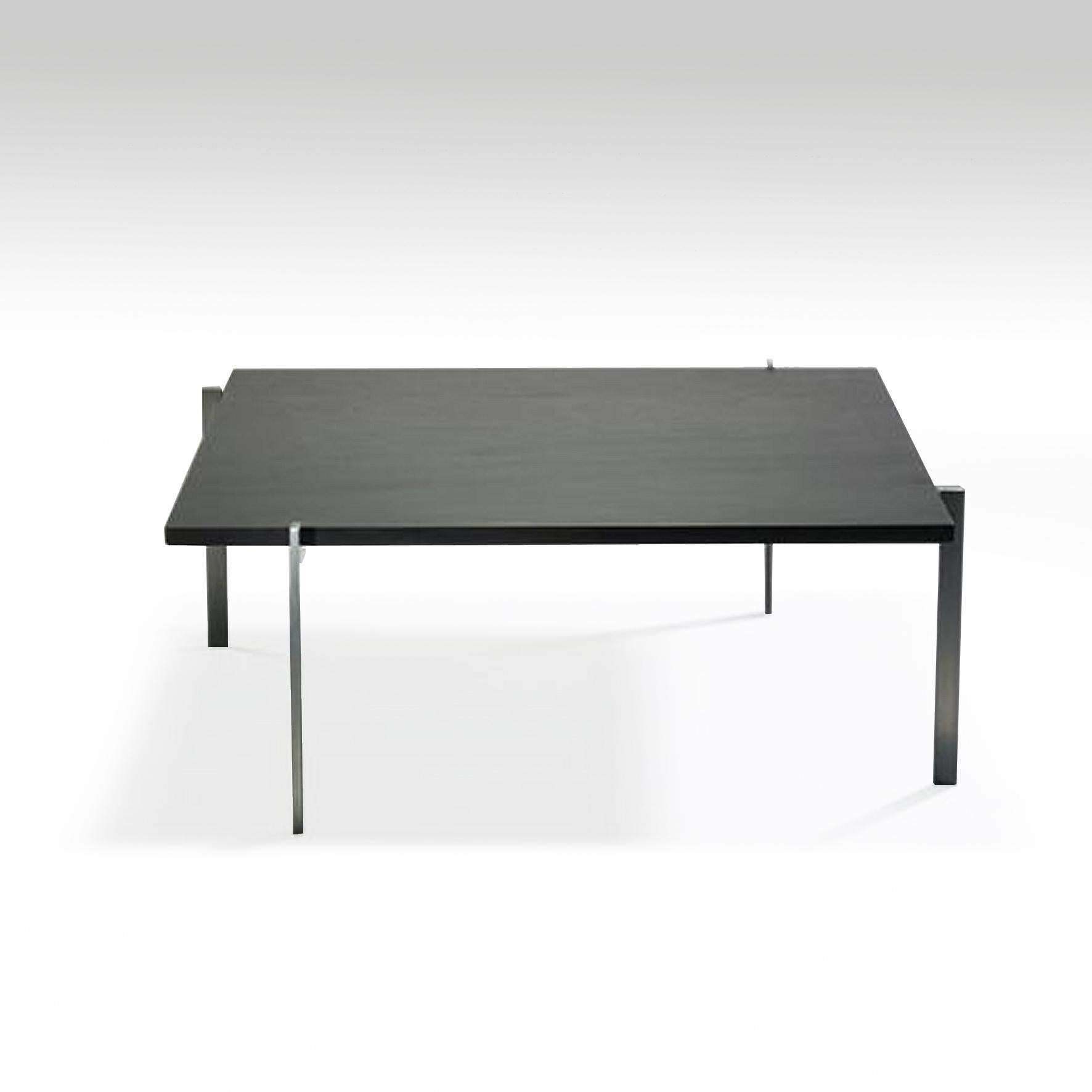 A square coffee table with a slate top on a four legs matte chrome-plated steel stand, 
Denmark.
Model created in 1956.
First edition stamped by maker E. Kold Christensen.
 
Literature
Poul Kjaerholm, Arkitektens Forlag, pp. 86-87-175,