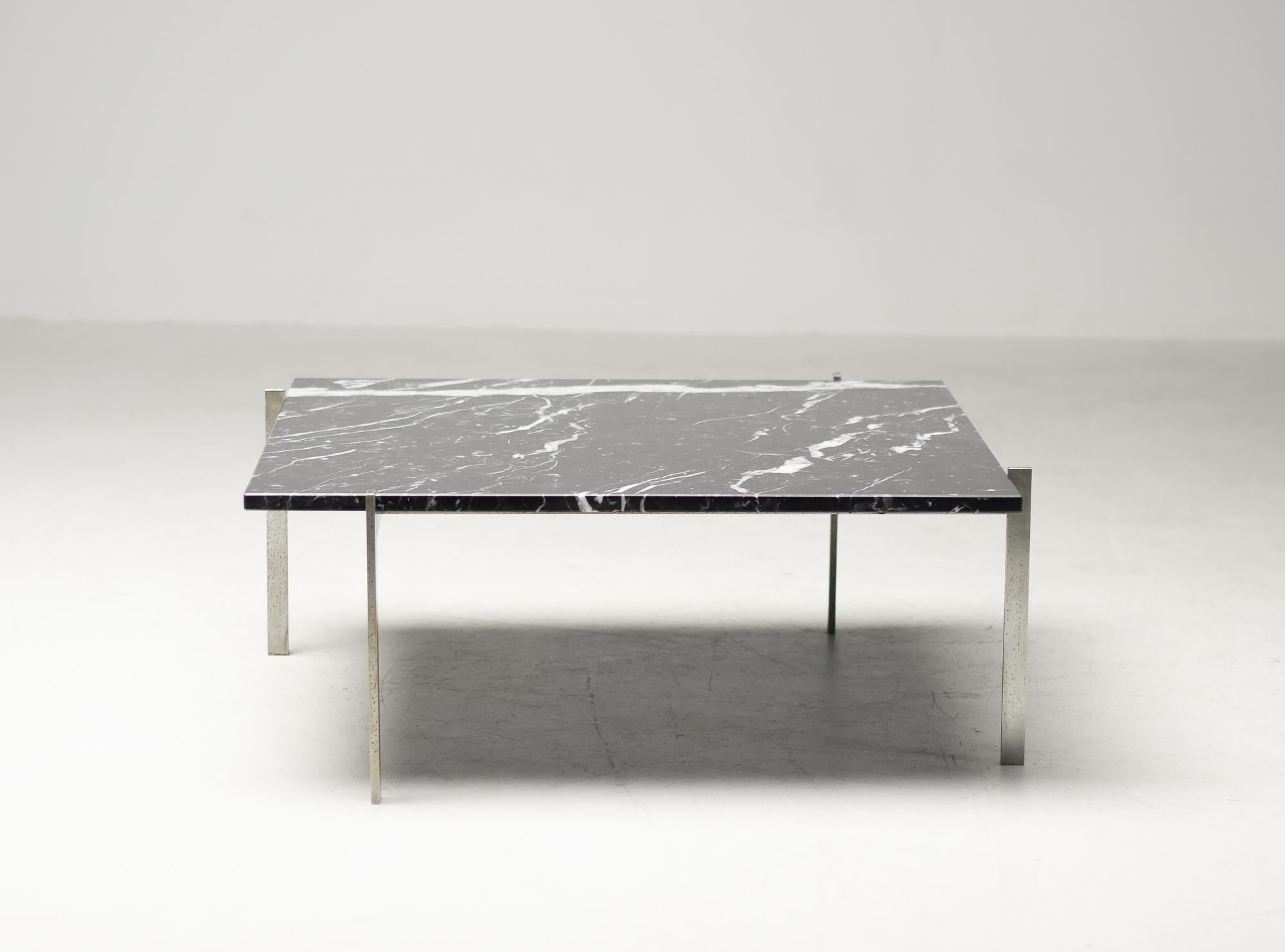 Poul Kjærholm for E. Kold Christensen, black marble and metal, Denmark, design 1955. 

This table by Kjærholm is the epitome of minimalistic yet monumental design. The 'swastika' shaped steel frame holds a beautiful worn black marble top. With