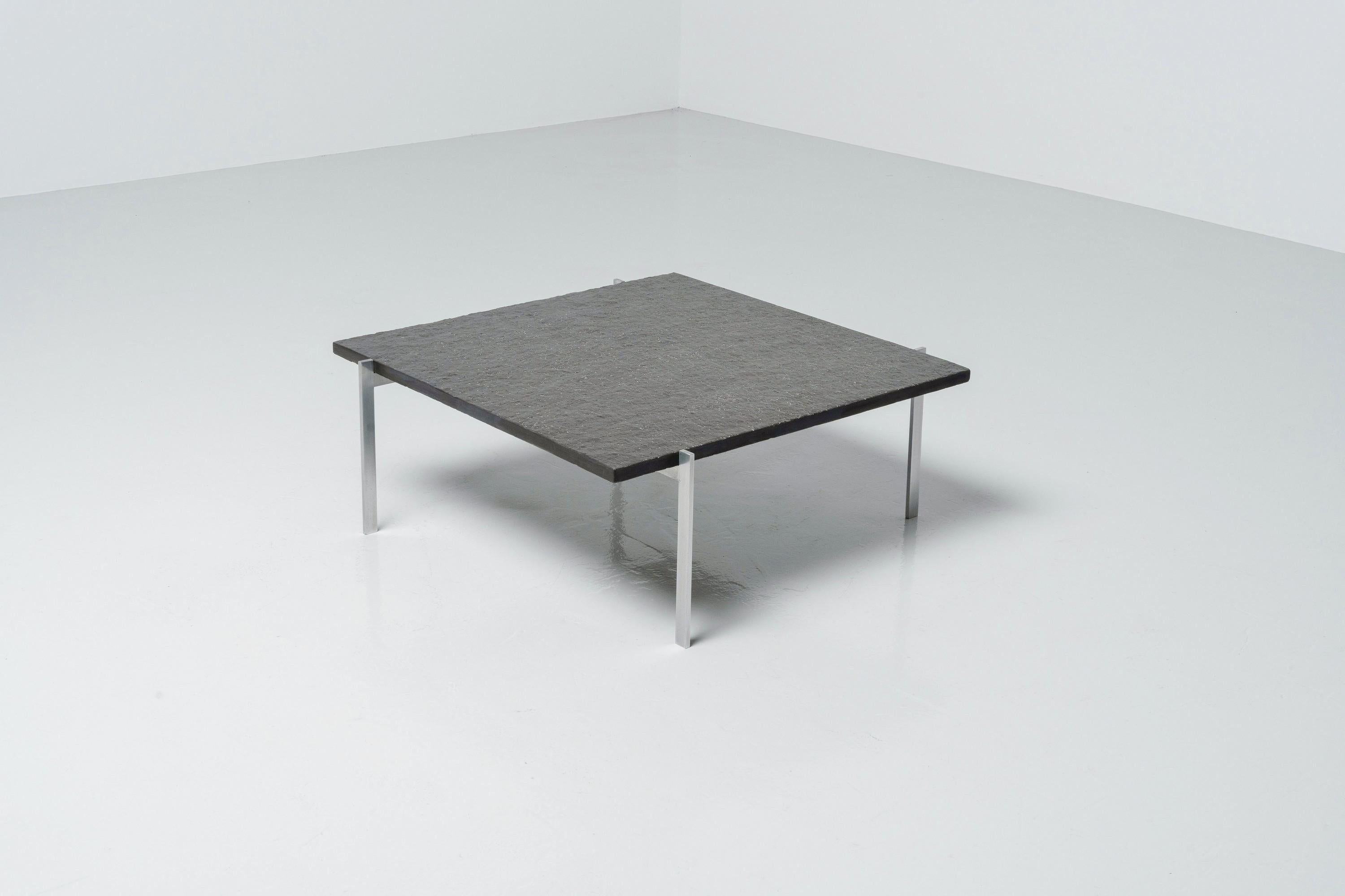 Iconic and one of the most well known designs by Poul Kjaerholm, is this model PK61 coffee table and was manufactured in Denmark by Ejvind Kold Christensen in 1956. The fantastic slate top has a nice grain and has a deep black colour, and is in a