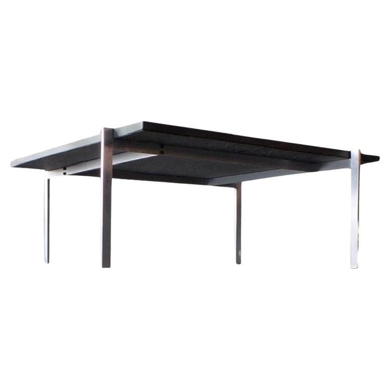 Poul Kjærholm PK61 dark granite coffee table, Fritz Hansen, Denmark. Designed 1956. Manufactured 2008. 

The PK61™ coffee table is as minimalistic as it gets from the hand of Poul Kjærholm. The square, aesthetic design serves as a powerful manifesto