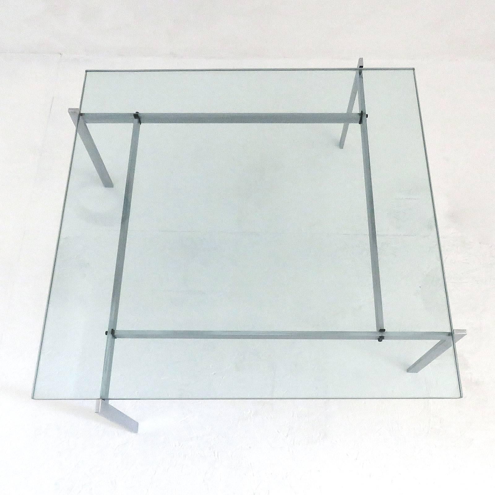 Iconic early version PK-61 coffee table, designed by Poul Kjærholm, 1969 for E. Kold Christensen, Denmark, 1956-1981 in brushed, chromium-plated steel with glass top, marked with EKC logo.