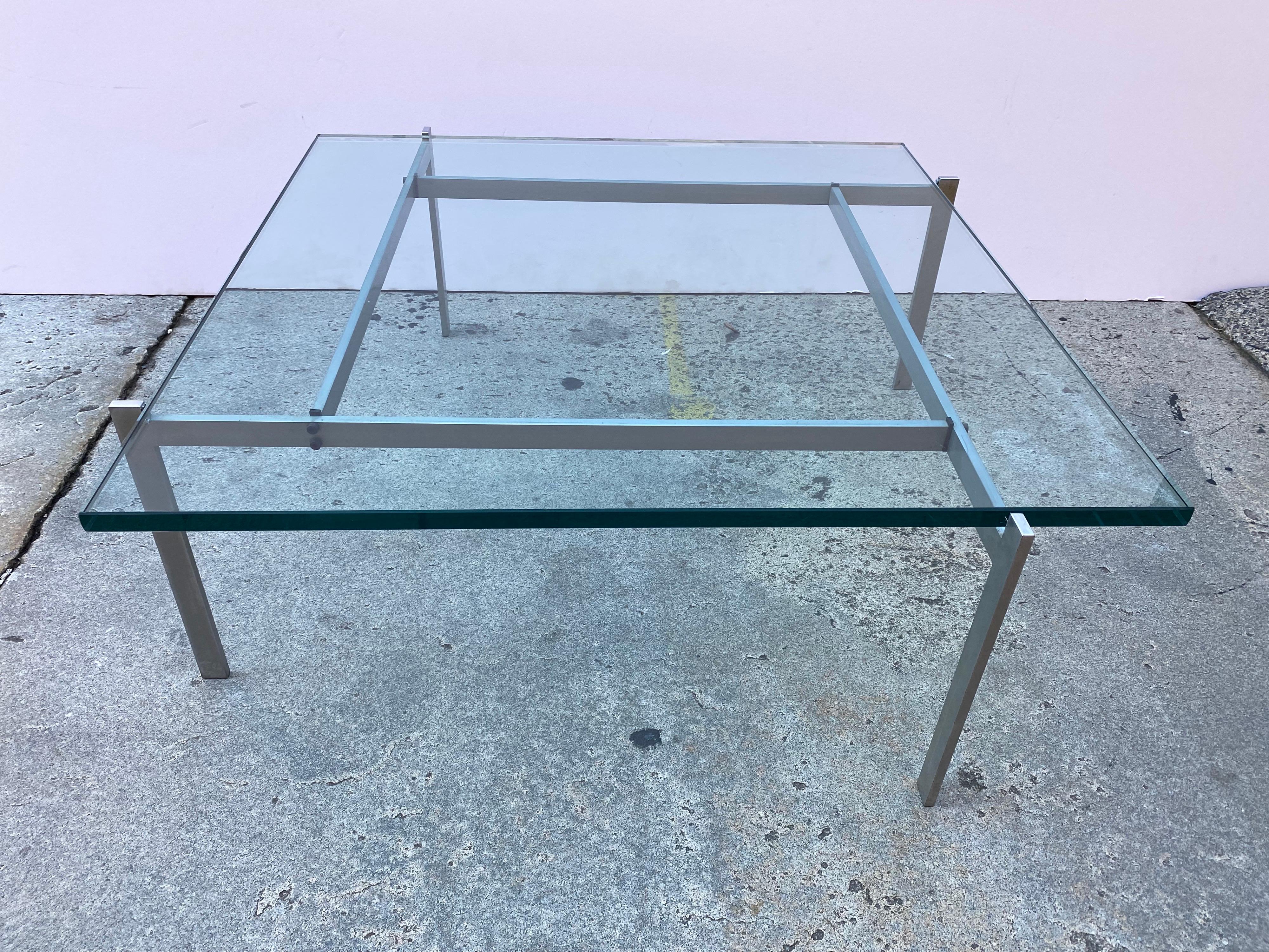 Poul Kjaerholm PK61 glass and steel coffee table. Originally designed in 1956. Produced by E. Kold Christiansen. Classic Danish Design. Sculptural Architectural Form that looks amazing with a glass Top! Manufacturer Mark on Steel.