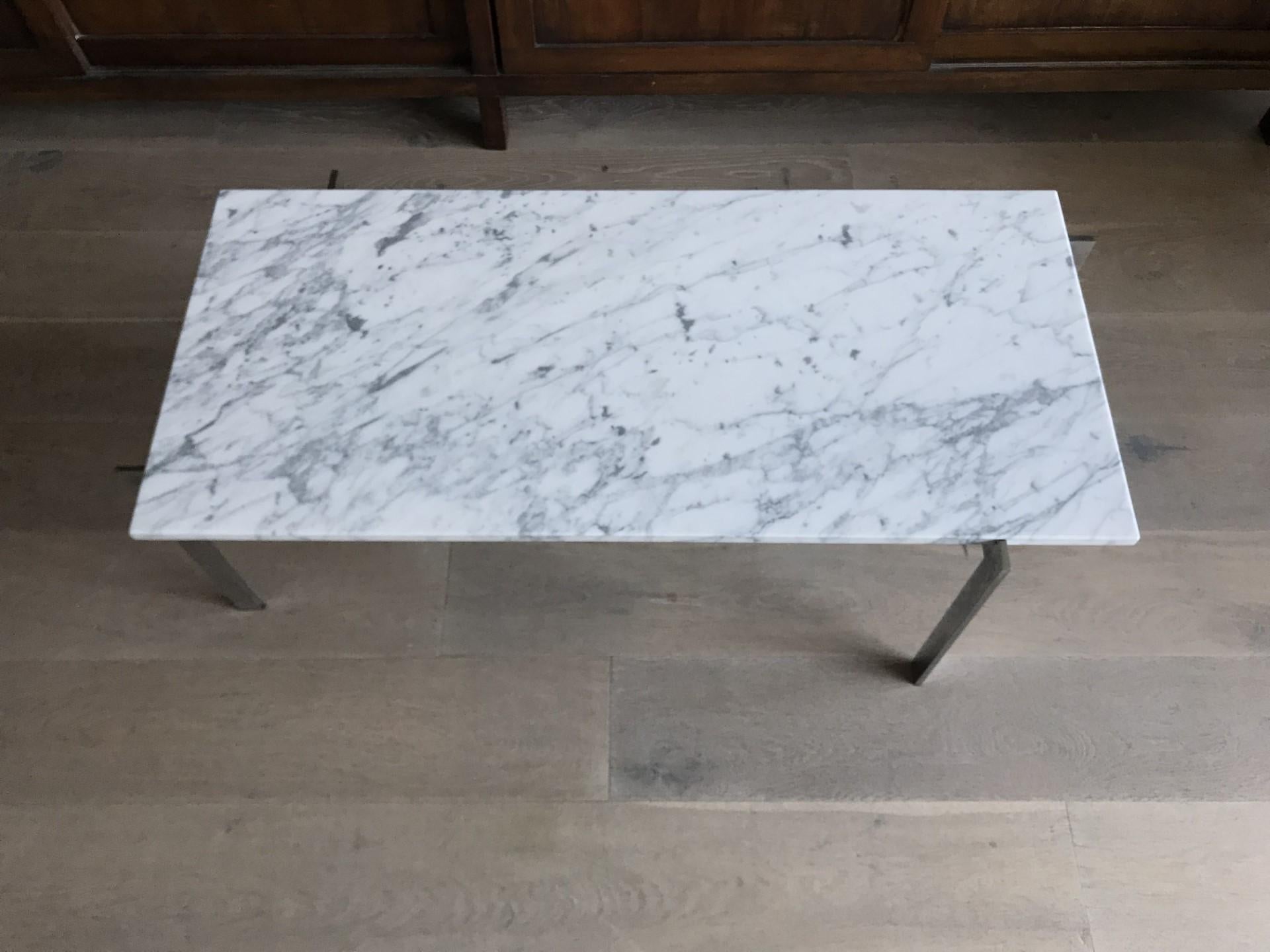A rectangular PK64 coffee table with a white marble top on a four legged matte chrome-plated steel stand.
Produced by Fritz Hansen, Denmark.
1995