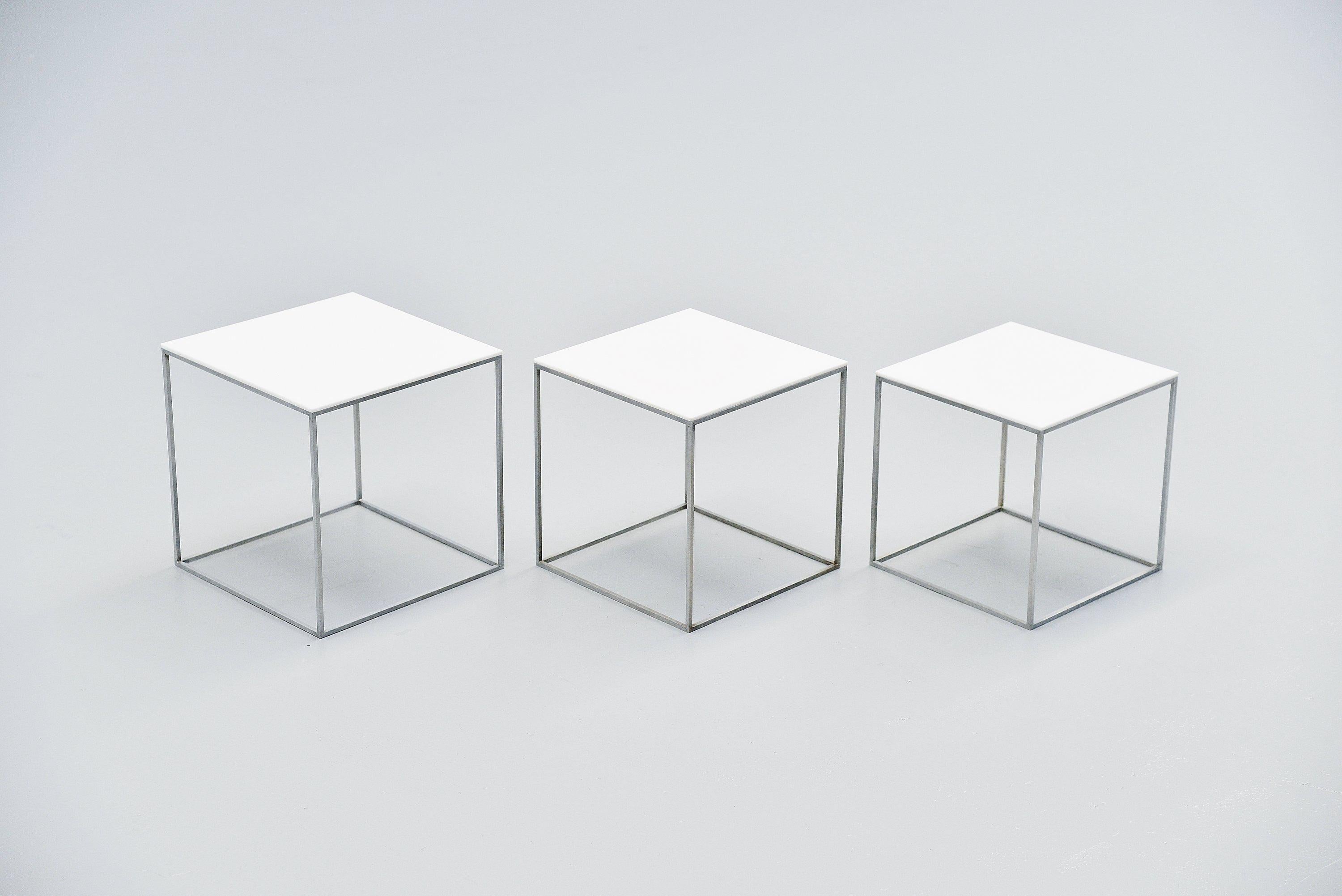 Early set of PK71 nesting tables designed by Poul Kjaerholm and manufactured by Ejvind Kold Christensen, Denmark, 1957. These Minimalist shaped nesting tables have a stainless steel frame and white polished Perspex tops. The tables are in good