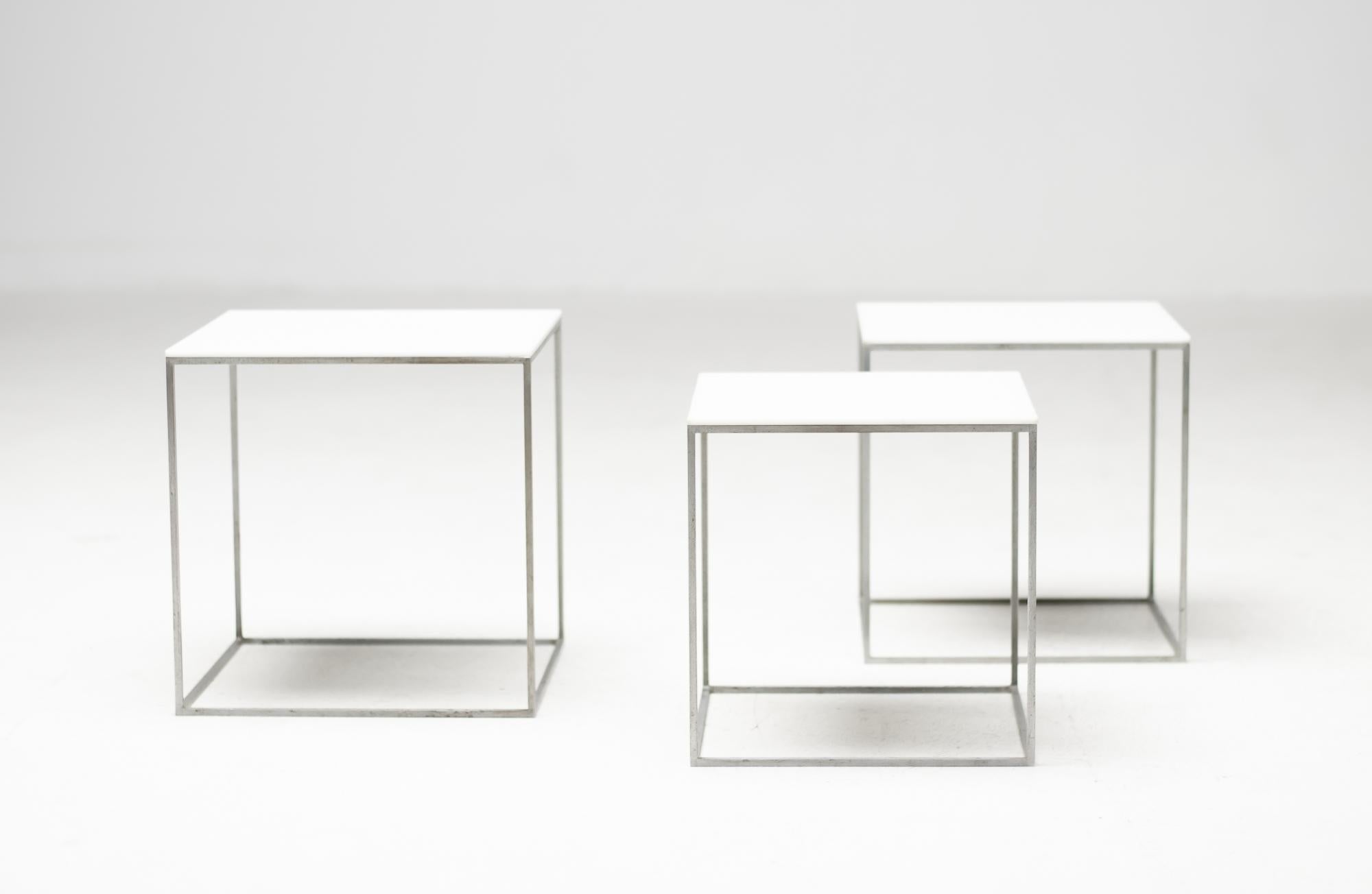 Great set of white nesting tables model PK71 designed by Poul Kjærholm for Ejvind Kold Christensen, Denmark, 1957-1982. 
These tables are the unmarked early 1960 production. They have a matte chromium plated steel frame and white polished acrylic