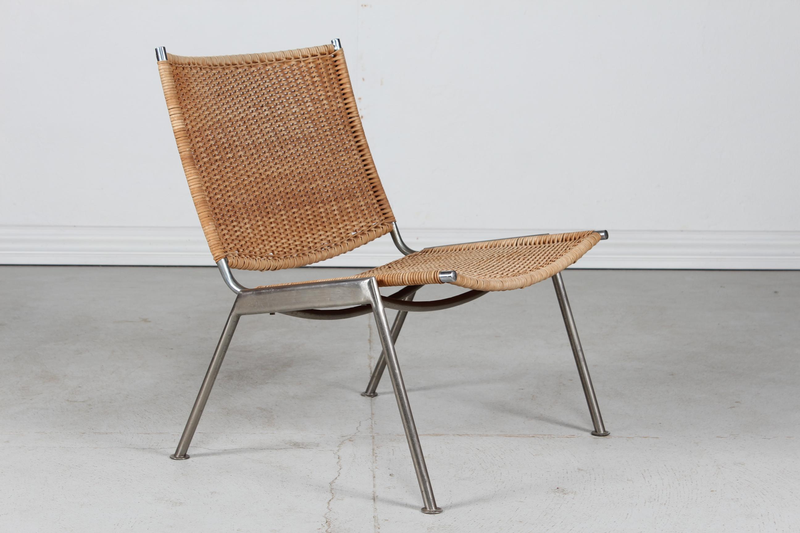 Danish Lounge chair in Poul Kjærholm style made in the 1960´s by a Danish furniture manufacturer.
The chair has a metal frame covered with seat and back rest of plaited cane

Nice vintage condition, cane also in very good condition

With its