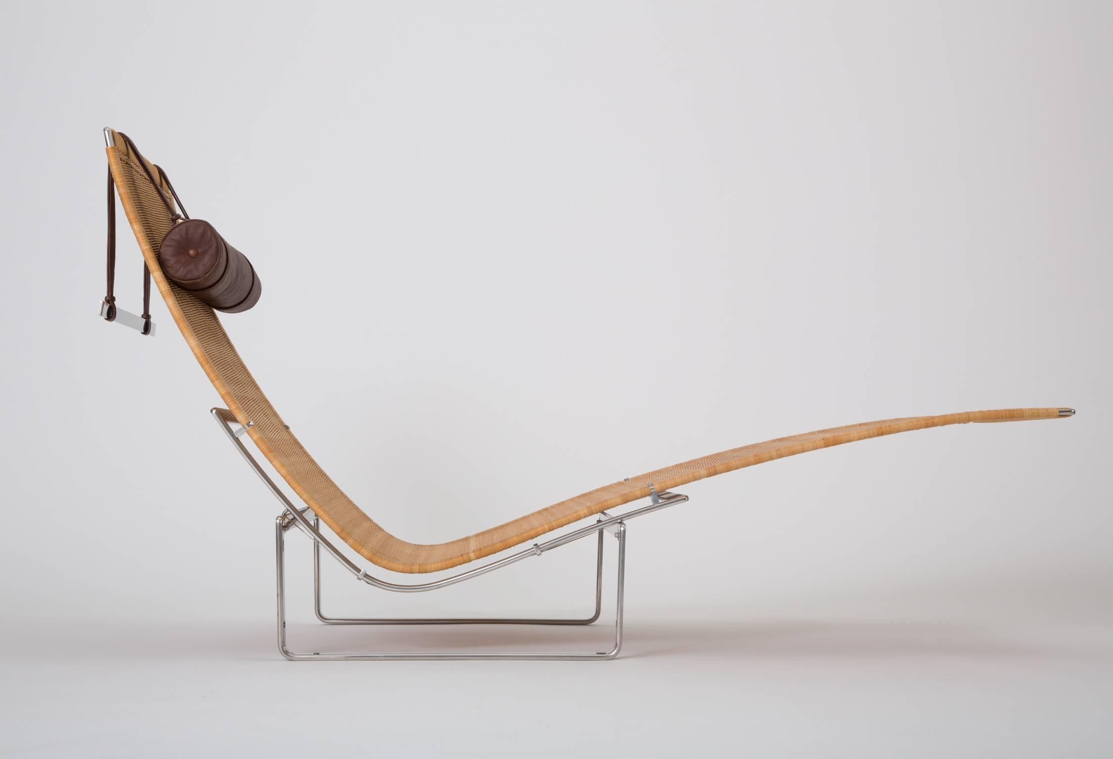 Designed in 1965 for E. Kold Christensen, the PK 24 chaise lounge is one of Poul Kjærholm’s most ambitious designs. A curved seat of exaggerated length is suspended between the two support bars of the polished frame on steel ribbons. The chair seat