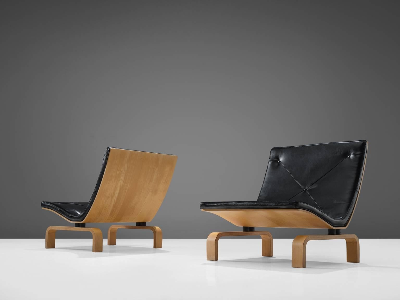 Poul Kjærholm for E. Kold Christensen, PK-27 easy chairs, maple and black leather, Denmark, design 1971, later production.

This set of chairs designed by Kjærholm is made from moulded laminated maple and black leather. The chairs have a seat that