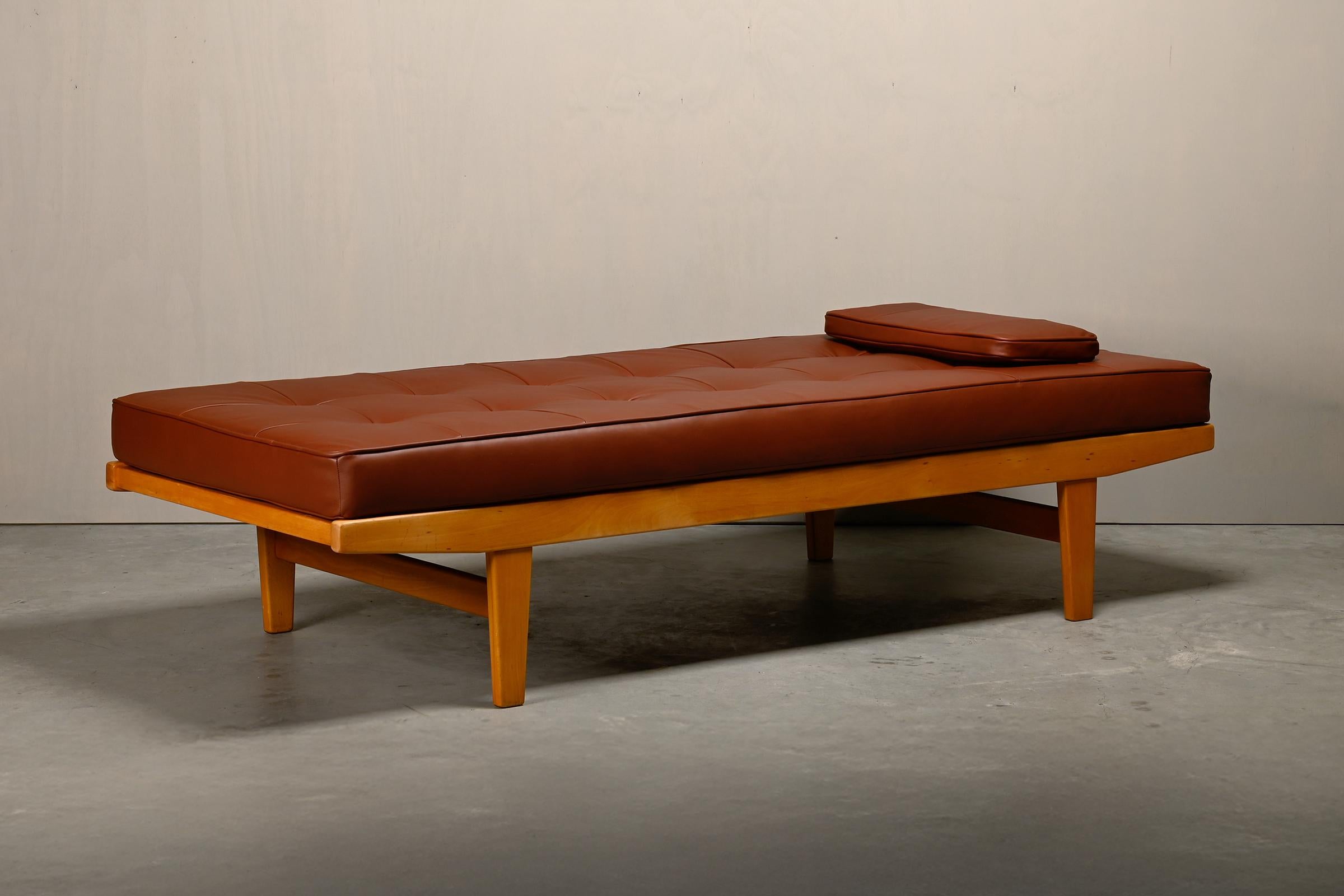 Beautiful Daybed designed by Poul M. Volther for FDB Møbler, Denmark. Solid Beech frame and Ash slats. The Daybed is in very good condition with small signs of wear and signed / dated with manufacturers stamp. New mattress upholstered in high