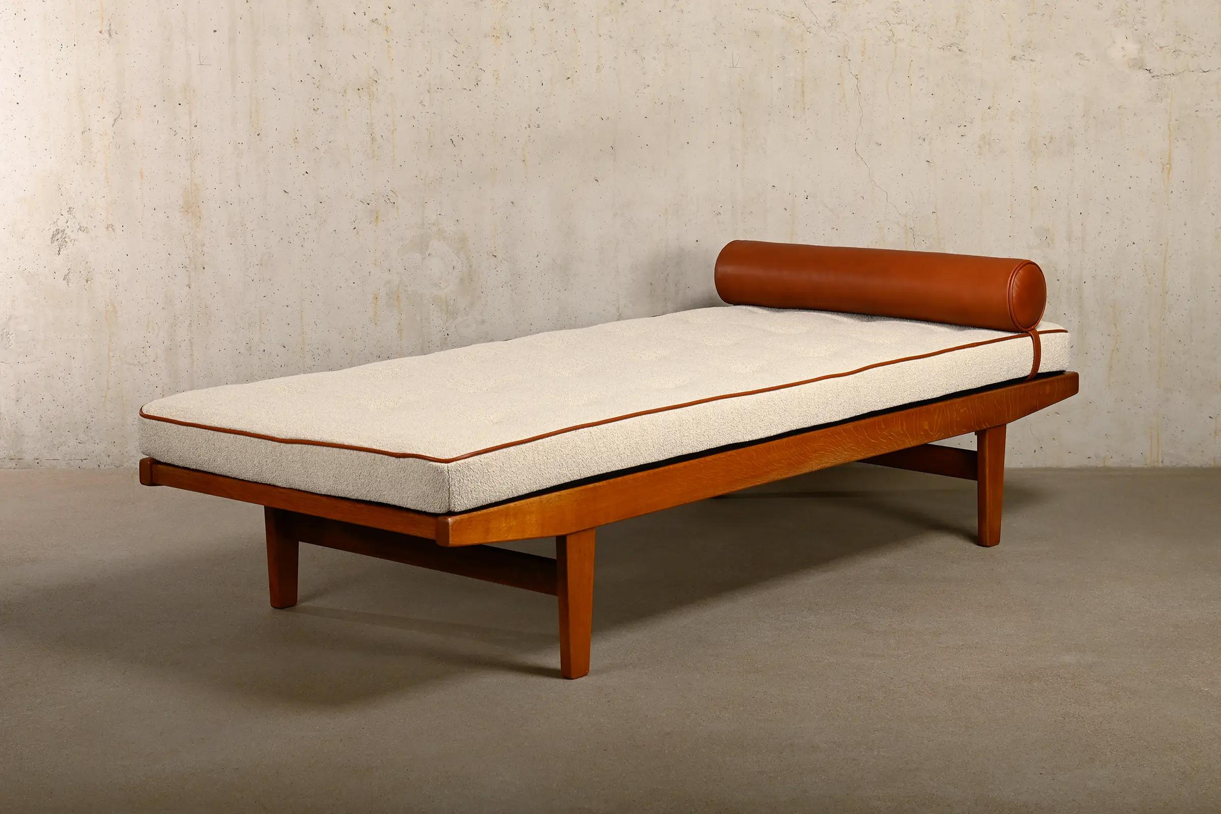 Elegant Daybed designed by Poul M. Volther for FDB Møbler, Denmark 1960s. Solid Oak frame with warm woodgrain and wooden slatted base. The Daybed is in very good condition with minor signs of wear and signed with manufacturer stamp. The Oak frame
