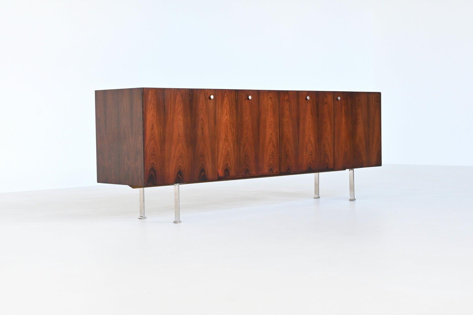 Striking and rare sideboard designed by Poul Nørreklit and manufactured by Georg Petersens Møbelfabrik, Denmark 1960. This sideboard is a remarkable showcase of rosewood's natural beauty and the refined craftsmanship typical of Danish furniture from
