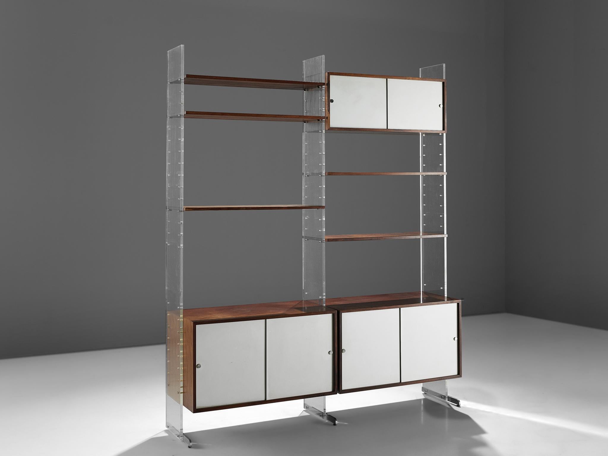 Poul Norreklit for Georg Petersens Møbelfabrik, 'Selectform' wall system, rosewood, aluminum and plexiglass, Denmark, late 1960s.

A substantial and functional storage system consisting of three sliding door cabinets and five shelves. The case