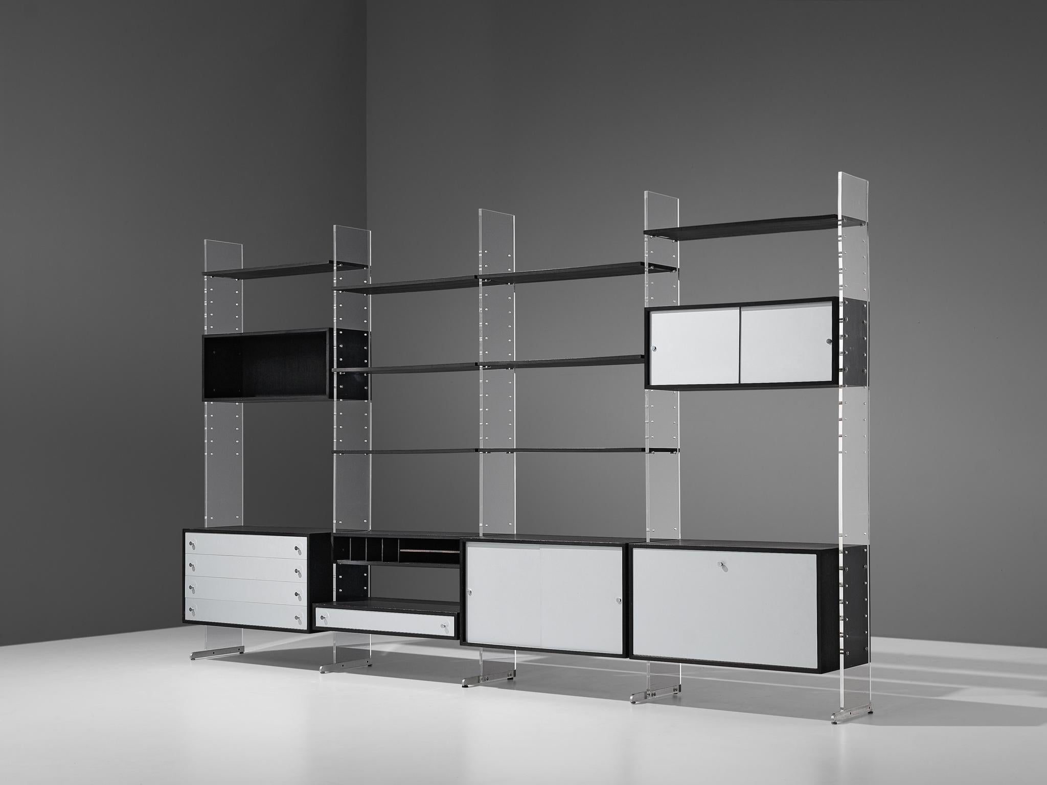 Poul Nørreklit for Selectform, free-standing cabinet, black lacquered wood, aluminum and plexiglas, Denmark, late 1960s 

A substantial and functional storage system consisting of various cabinets, drawers and multiple shelves. These can be