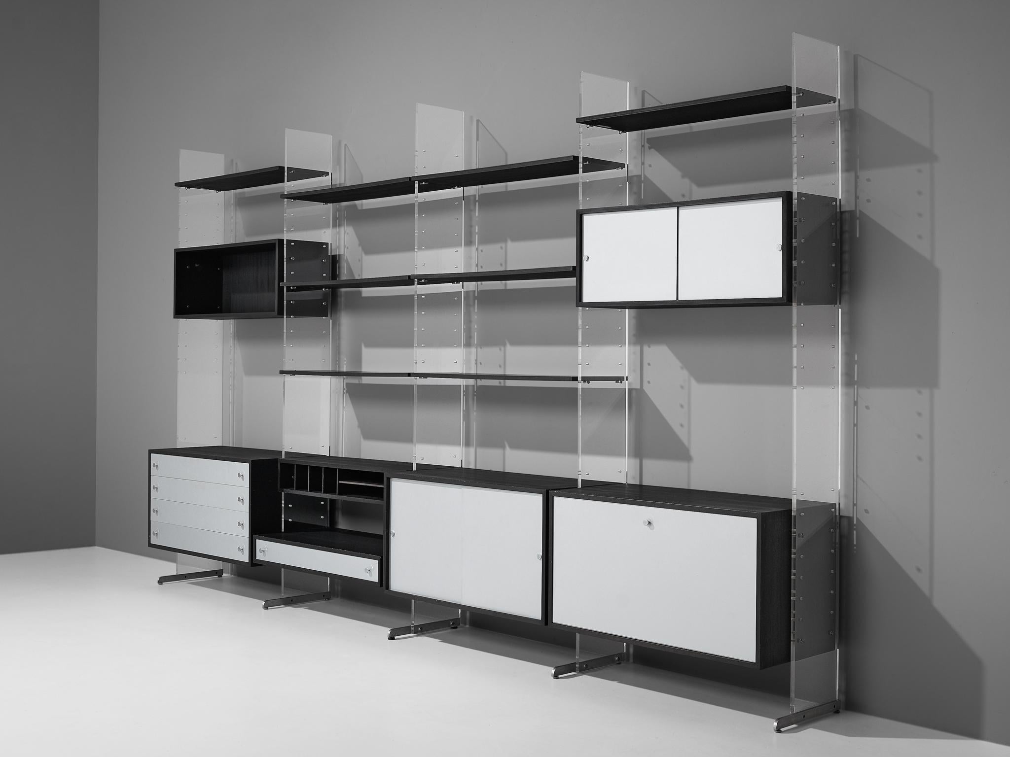 Poul Nørreklit for Georg Petersens Møbelfabrik, 'Selectform' wall unit, black lacquered wood, aluminium and plexiglas, Denmark, late 1960s 

A substantial and functional storage system consisting of various cabinets, drawers and multiple shelves