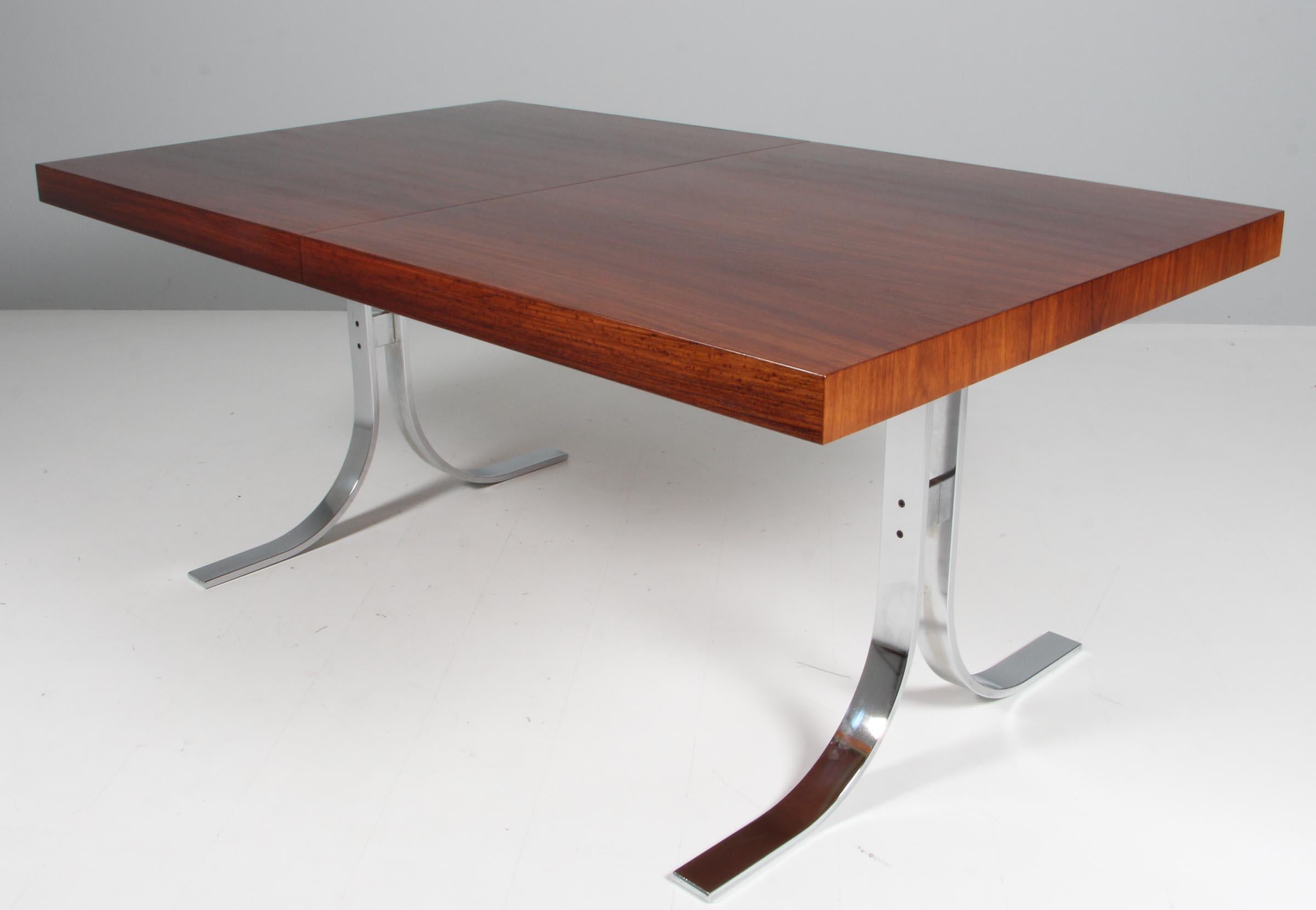Scandinavian Modern Poul Nørreklit dining table with extension leaf. Rosweood and Chromed steel
