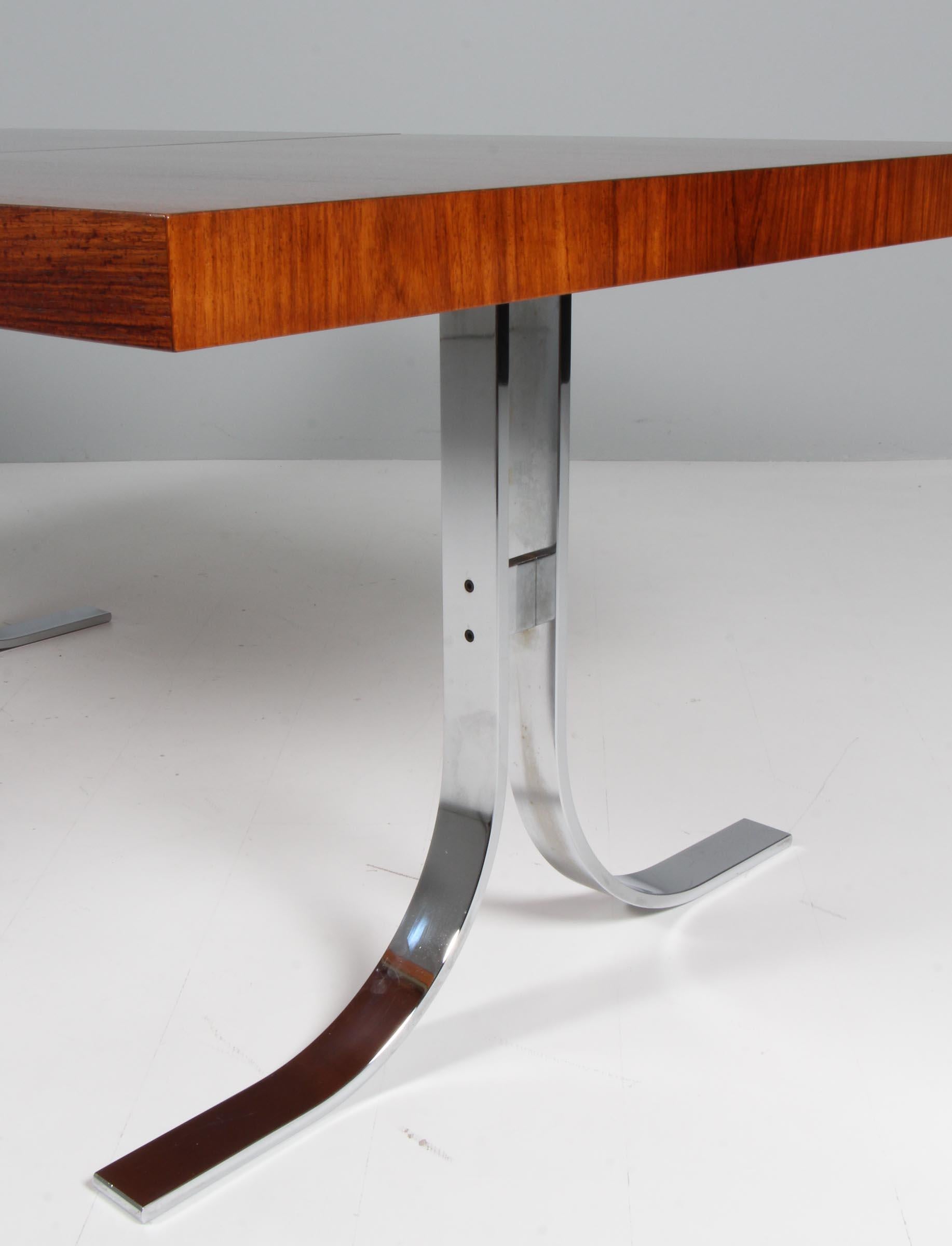 Mid-20th Century Poul Nørreklit dining table with extension leaf. Rosweood and Chromed steel