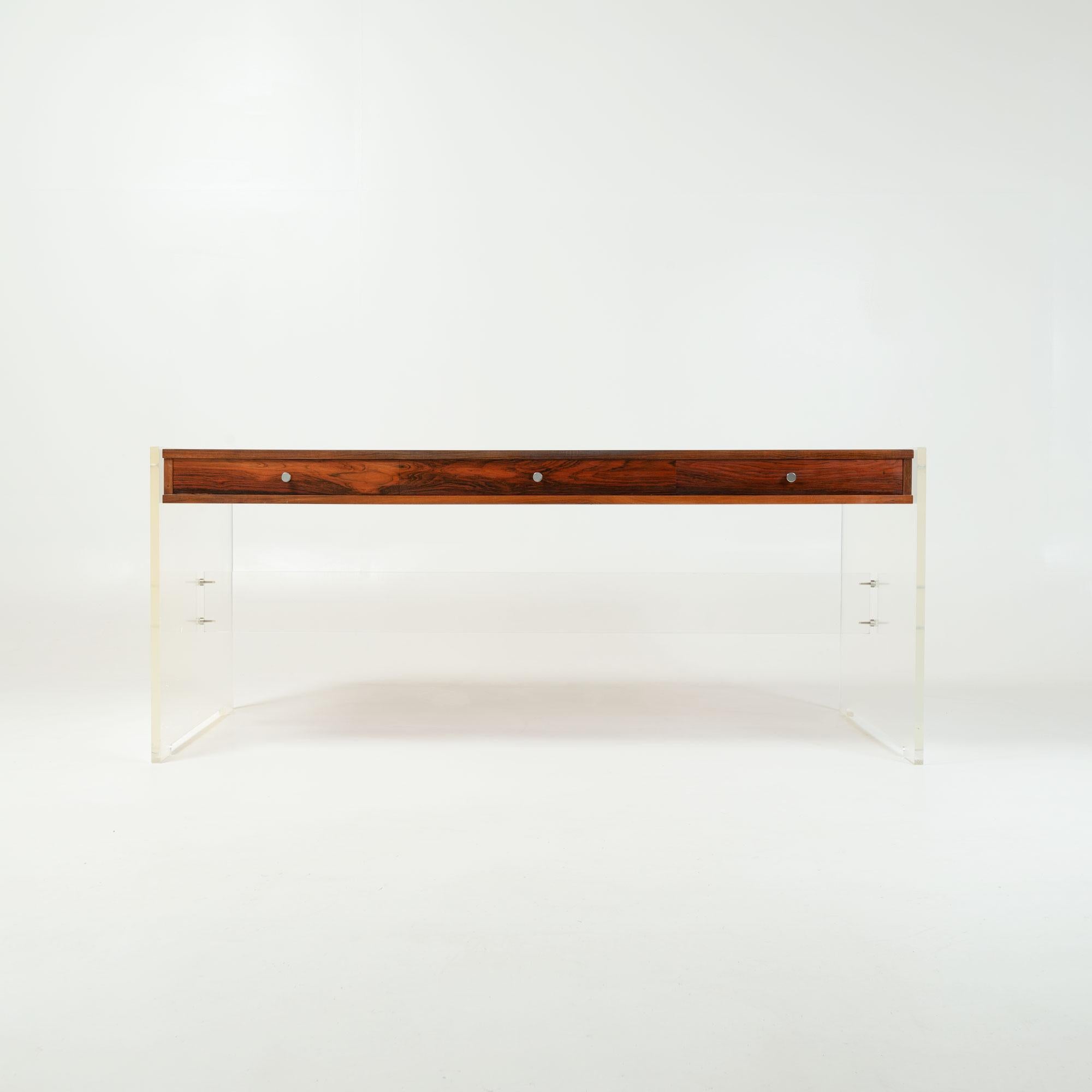 A rare an exceptional executive desk designed by Poul Nørreklit for Georg Petersens Møbelfabrik in the 70s. Poul Nørreklit most recognizable work often combine the use of acrylic and wood in furniture making, resulting in a futuristic take on