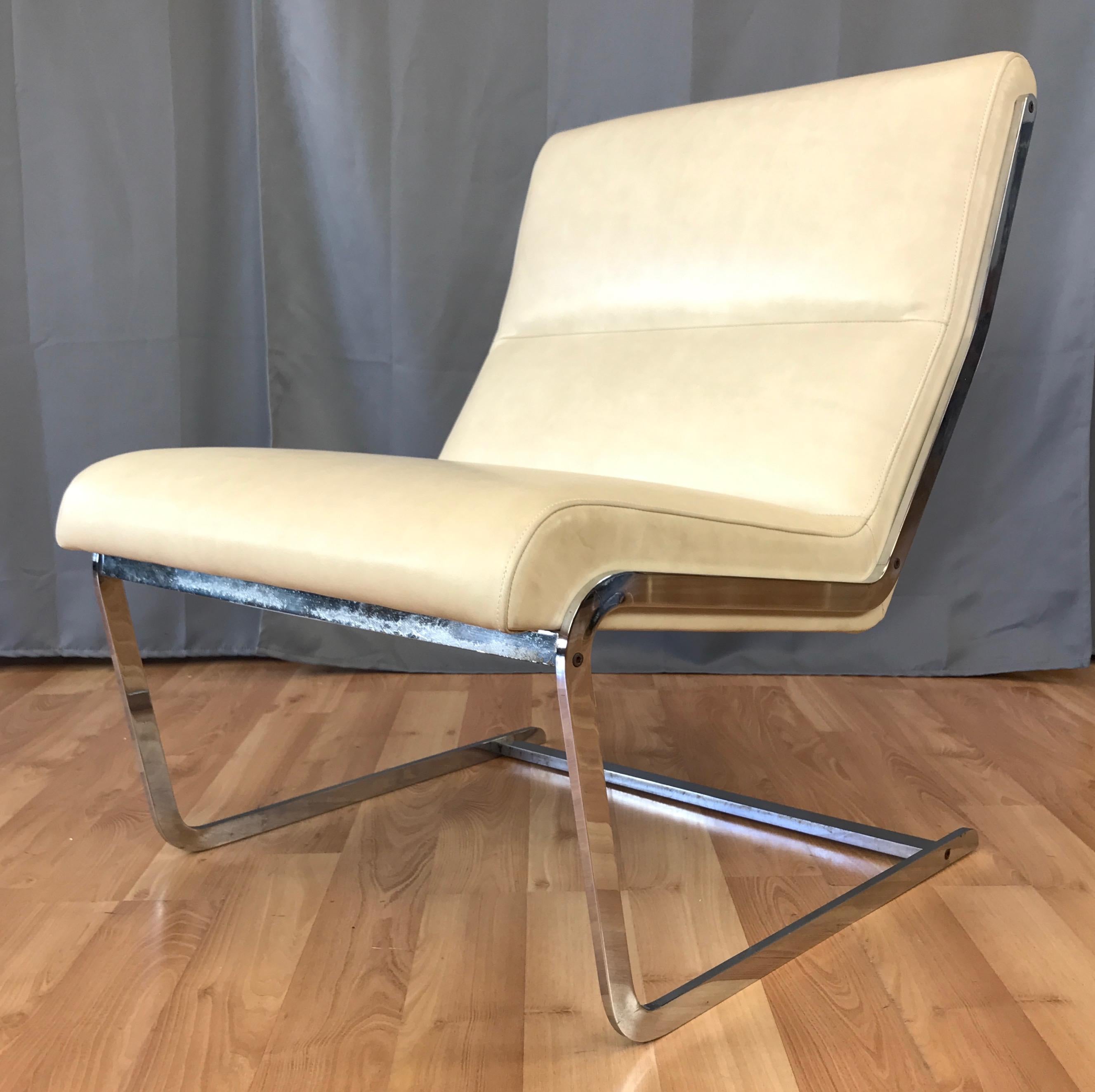 An uncommon leather and chrome cantilevered lounge chair by master of Scandinavian Modern minimalism Poul Nørreklit.

Heavy frame of flat bar steel with a polished chrome-like finish. Sleek seat freshly reupholstered in super supple high grade