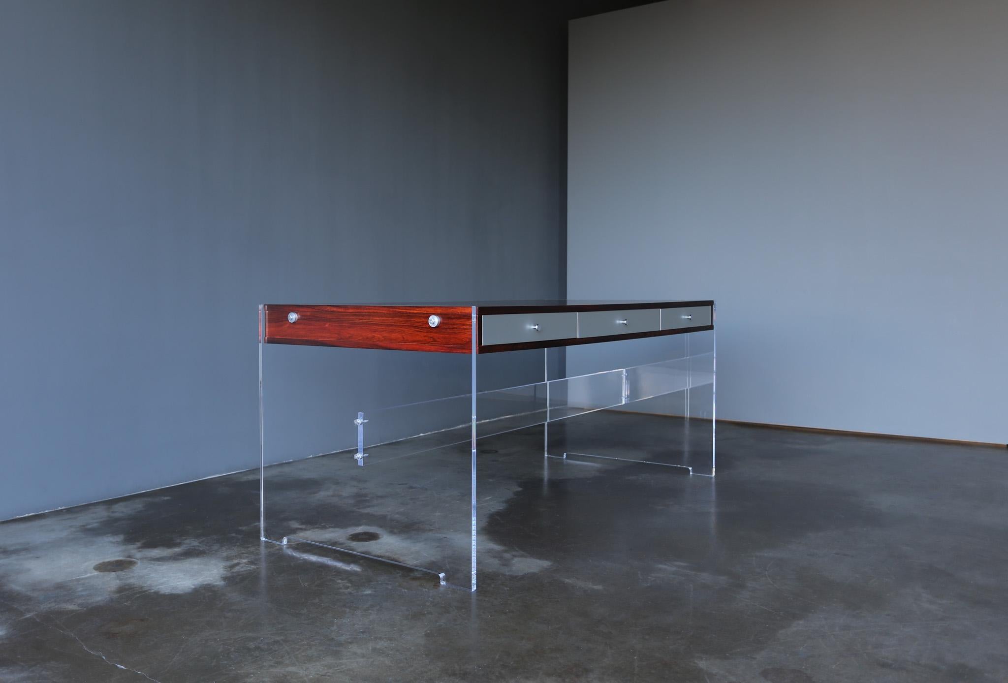 Poul Nørreklit Rosewood & Lucite Desk for Georg Petersens.  Denmark, circa 1960.  This piece has been expertly restored.