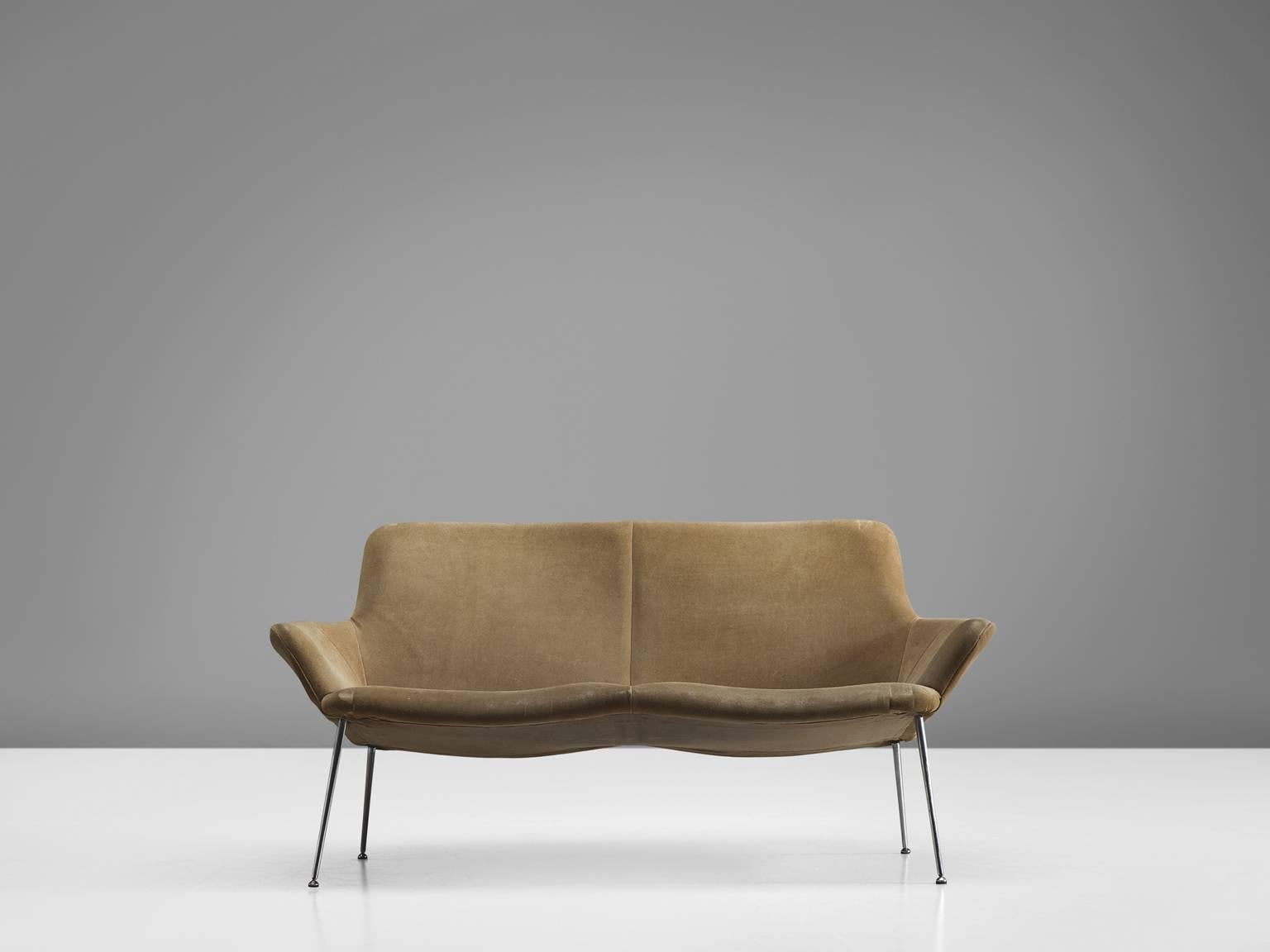Sofa in metal and suede by Poul Nørreklit, Denmark, 1960s

This settee is upholstered with sand colored suede upholstery. The shell is slightly tilted and features a wide seat. The open design of this chairs is emphasized by the chromed tubular
