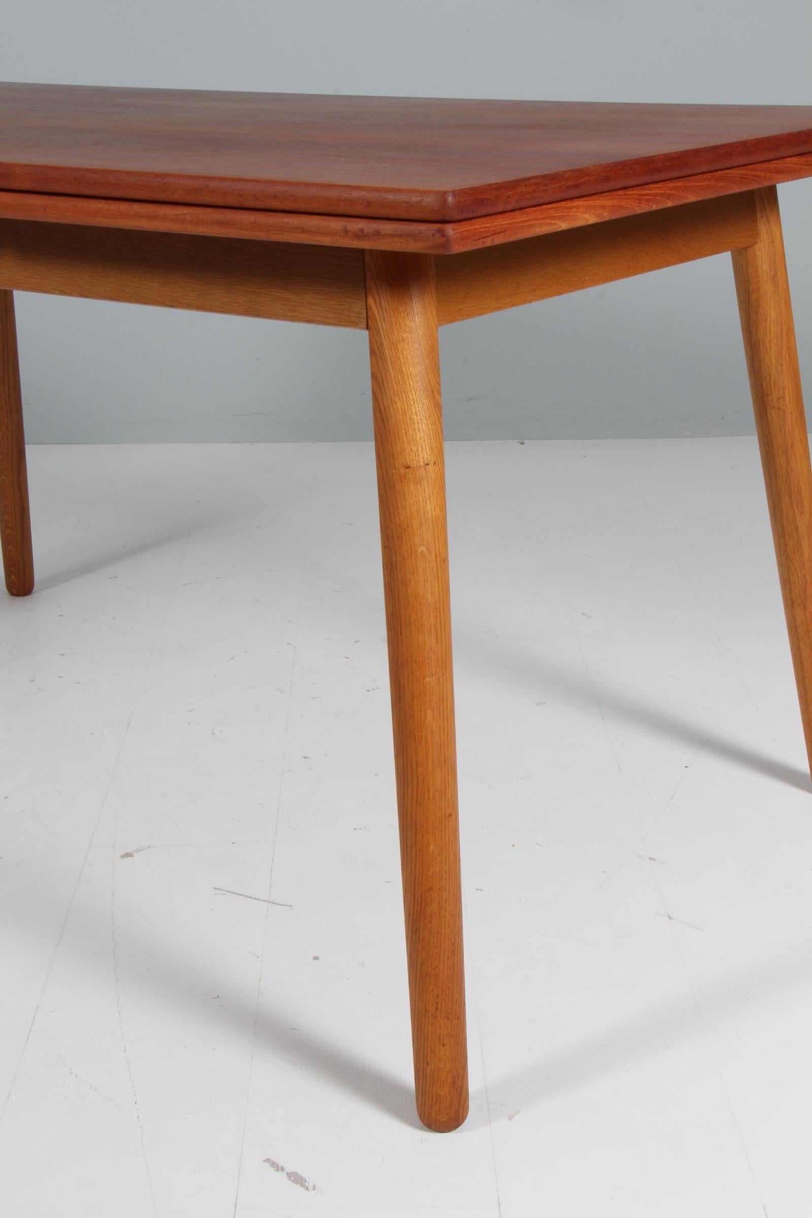 Danish Poul Volther for FDB dining table in teak and oak, extension leafes. For Sale