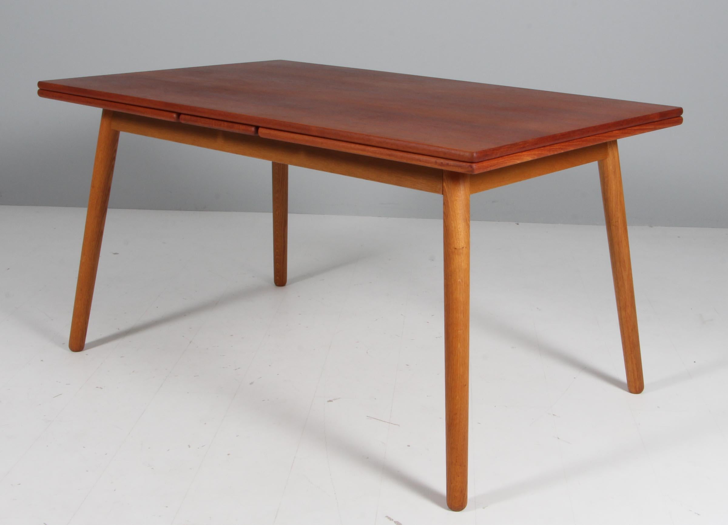 Poul Volther for FDB dining table in teak and oak, extension leafes. For Sale
